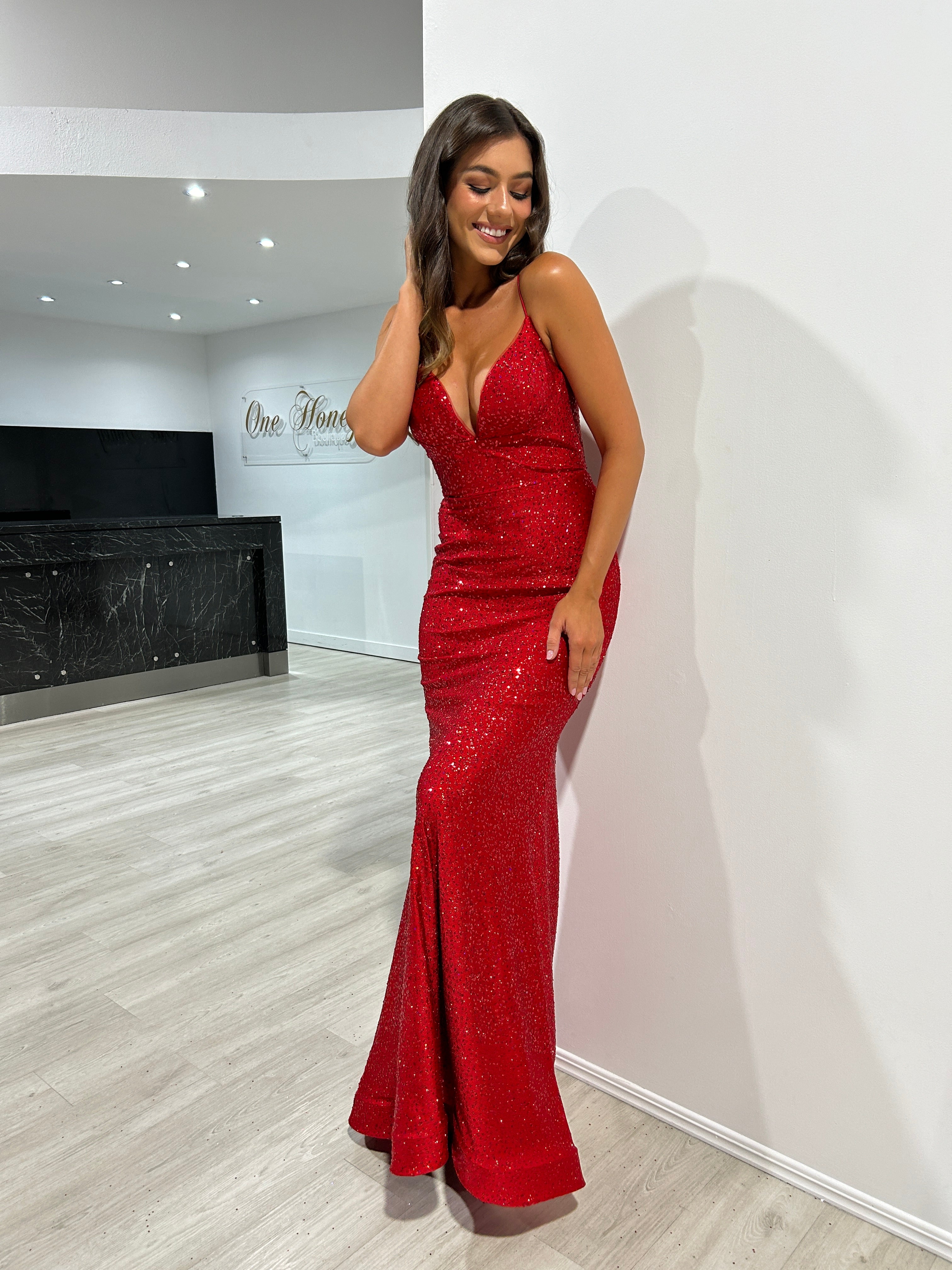 Woman wearing Honey Couture MAYA Red Glitter Mermaid Formal Gown, Australian Designer Evening Gown, perfect for prom or special occasions.