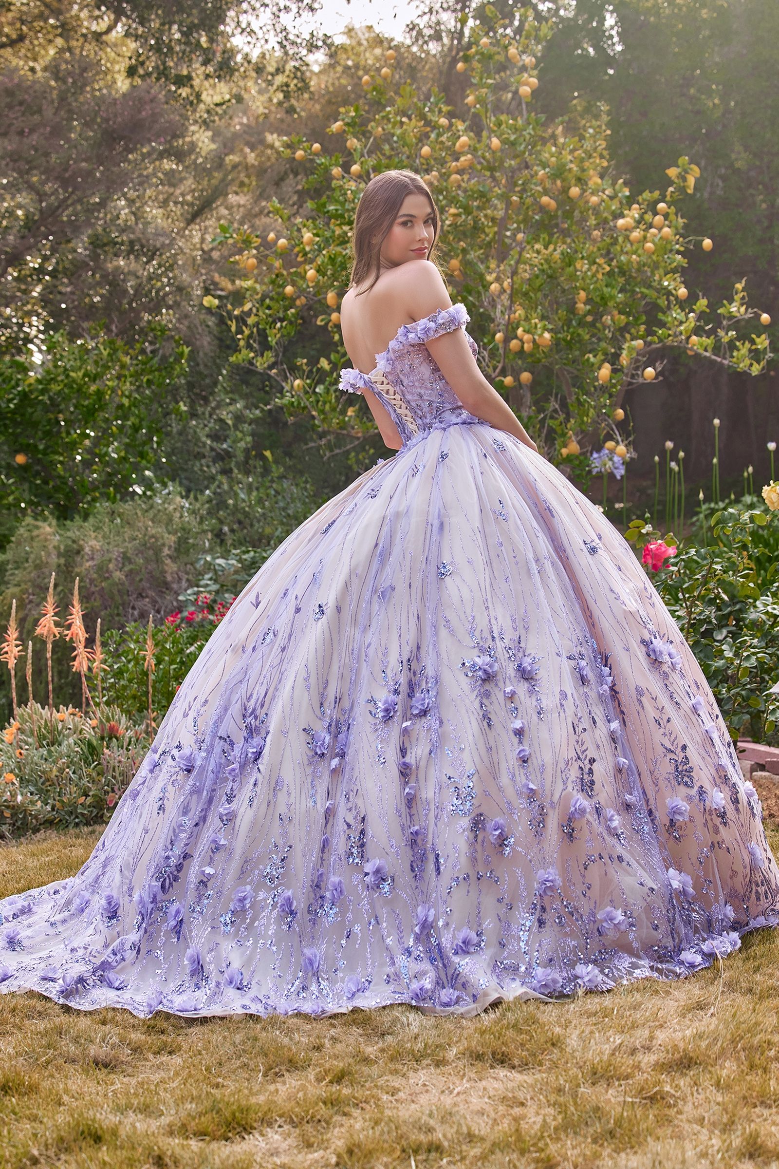 CLARALINA Off Shoulder Floral Applique Quinceañera Ball Gown with purple flowers in garden setting, Brisbane to Gold Coast.
