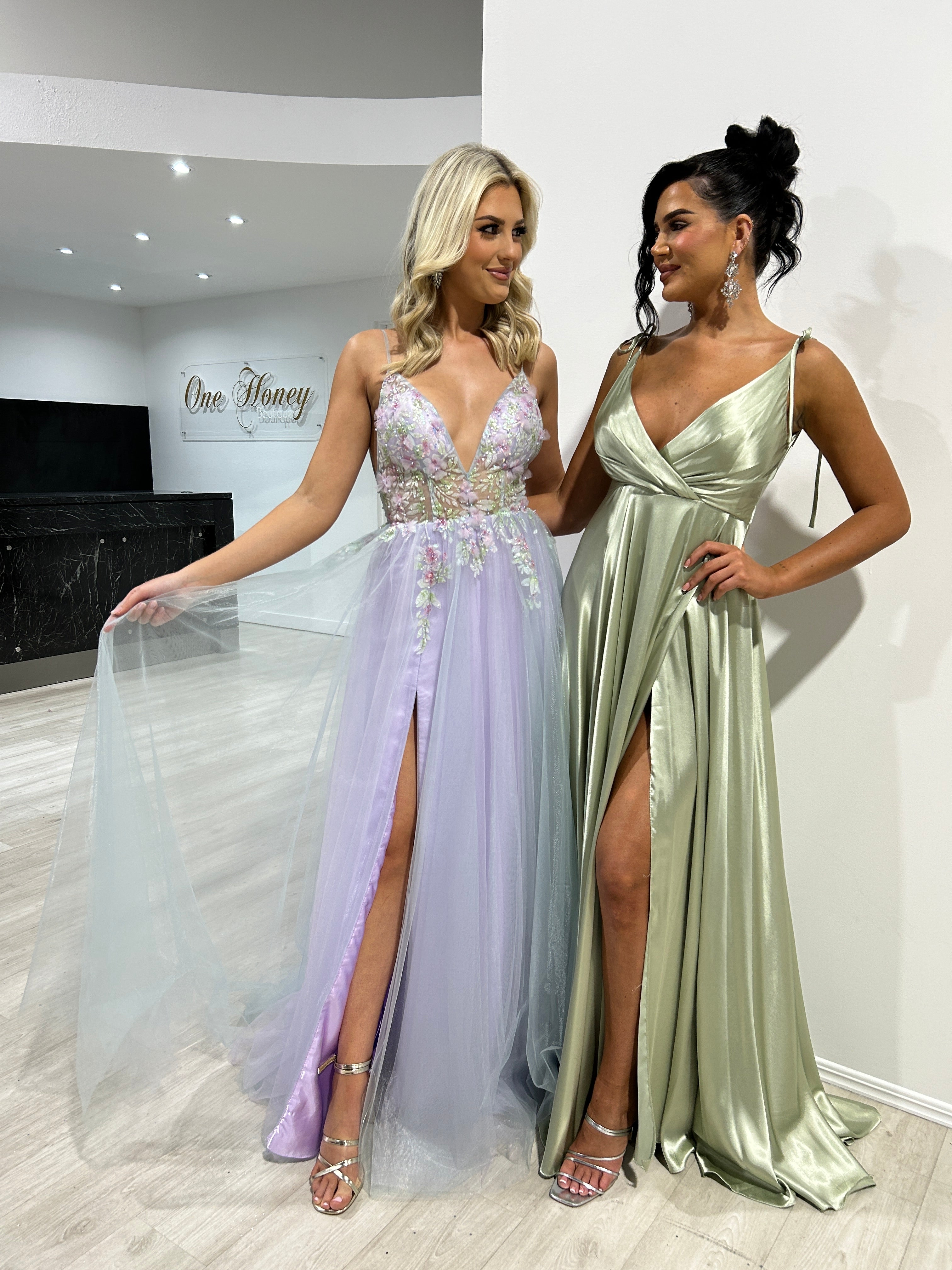 VANDA Lavender dress with floral appliqués and slit skirt, A-line formal gown with friend in green satin outfit. Brisbane to Gold Coast.