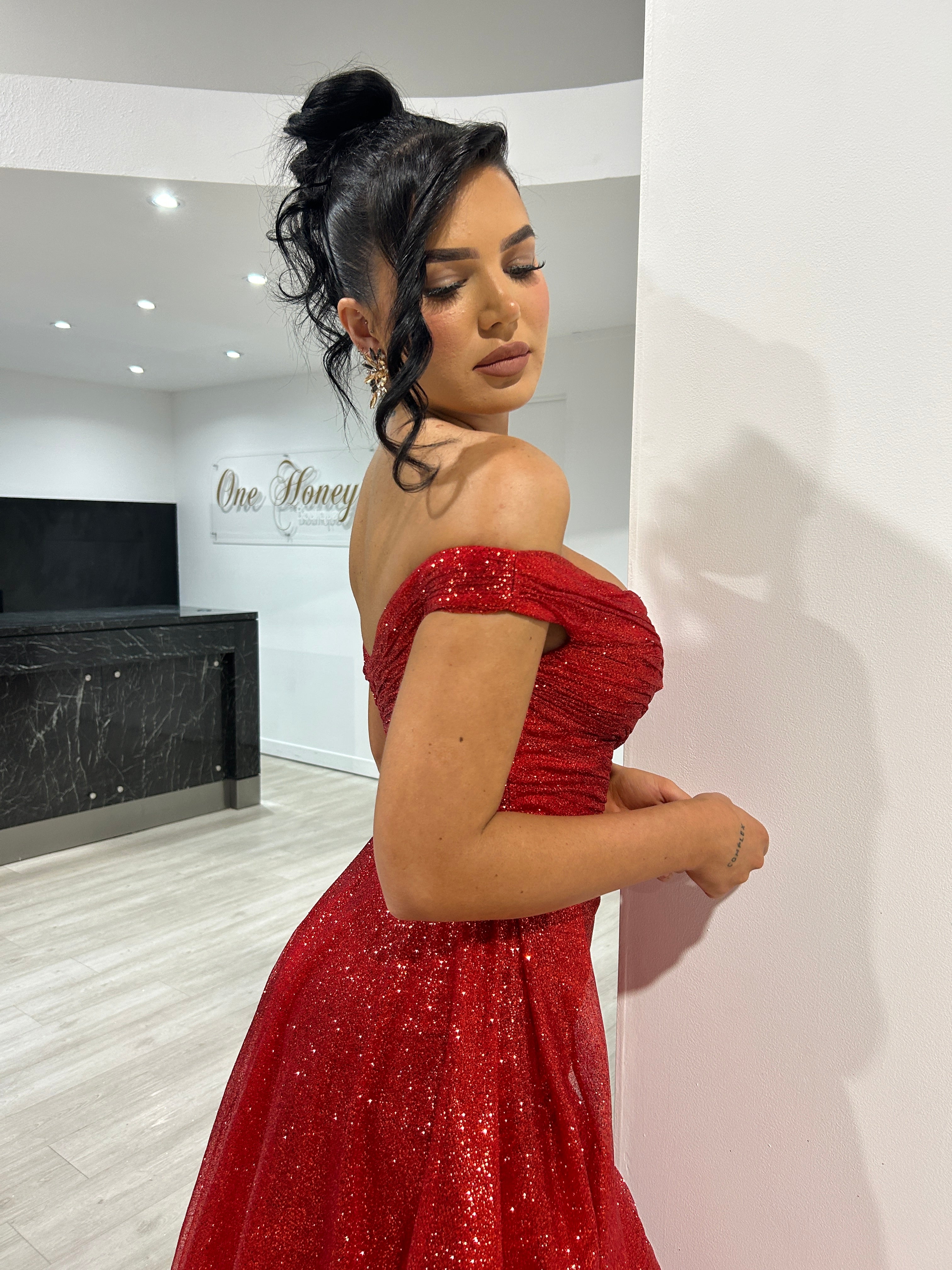 BEBE Glitter Off The Shoulder Dress, featuring a shimmering red overskirt evening gown. Perfect for Brisbane to Gold Coast.