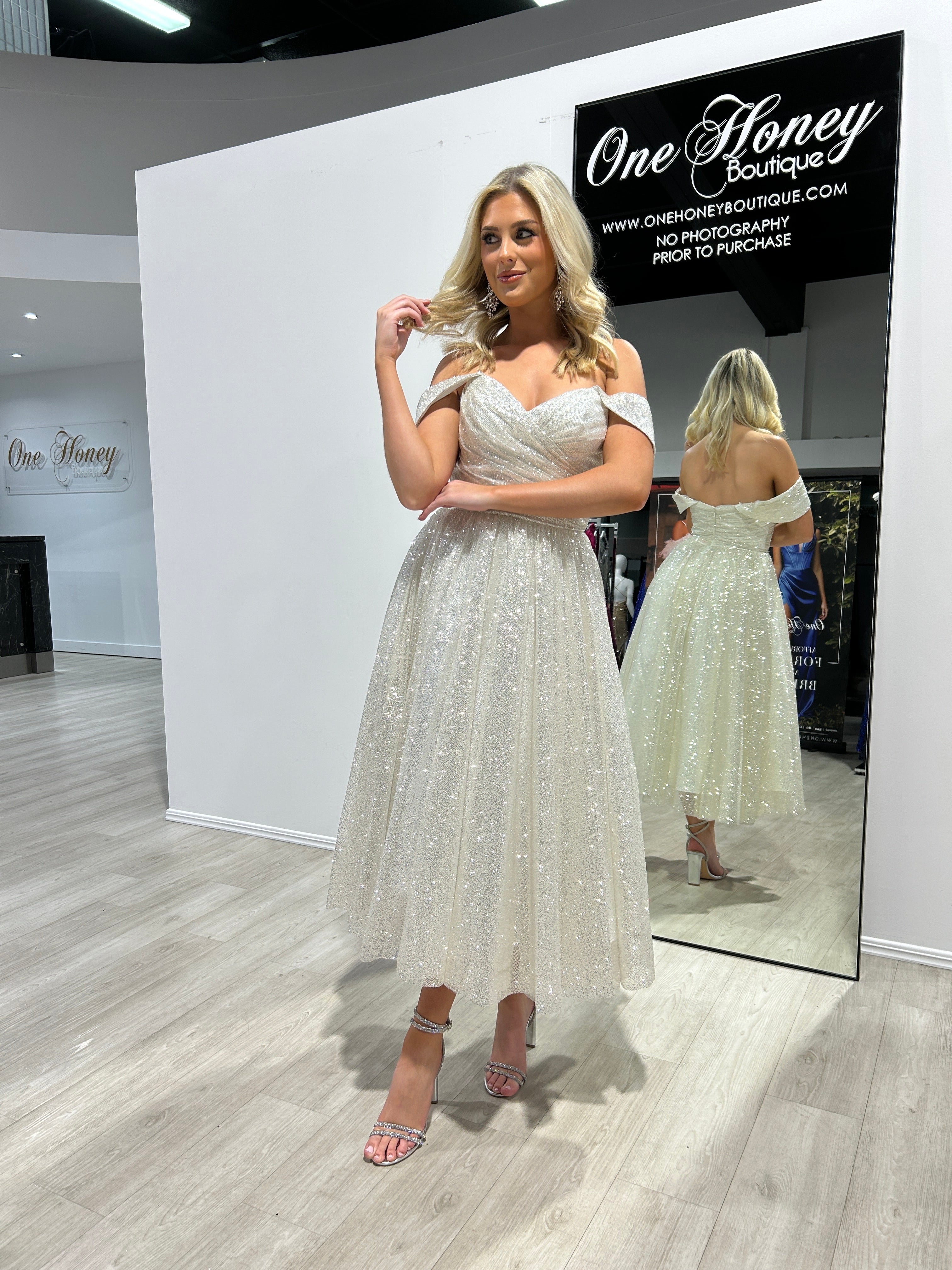 Woman wearing Honey Couture ALINA Off White Glitter Tea Length Ball Gown, showcasing Australian designer evening dress for formal occasions.