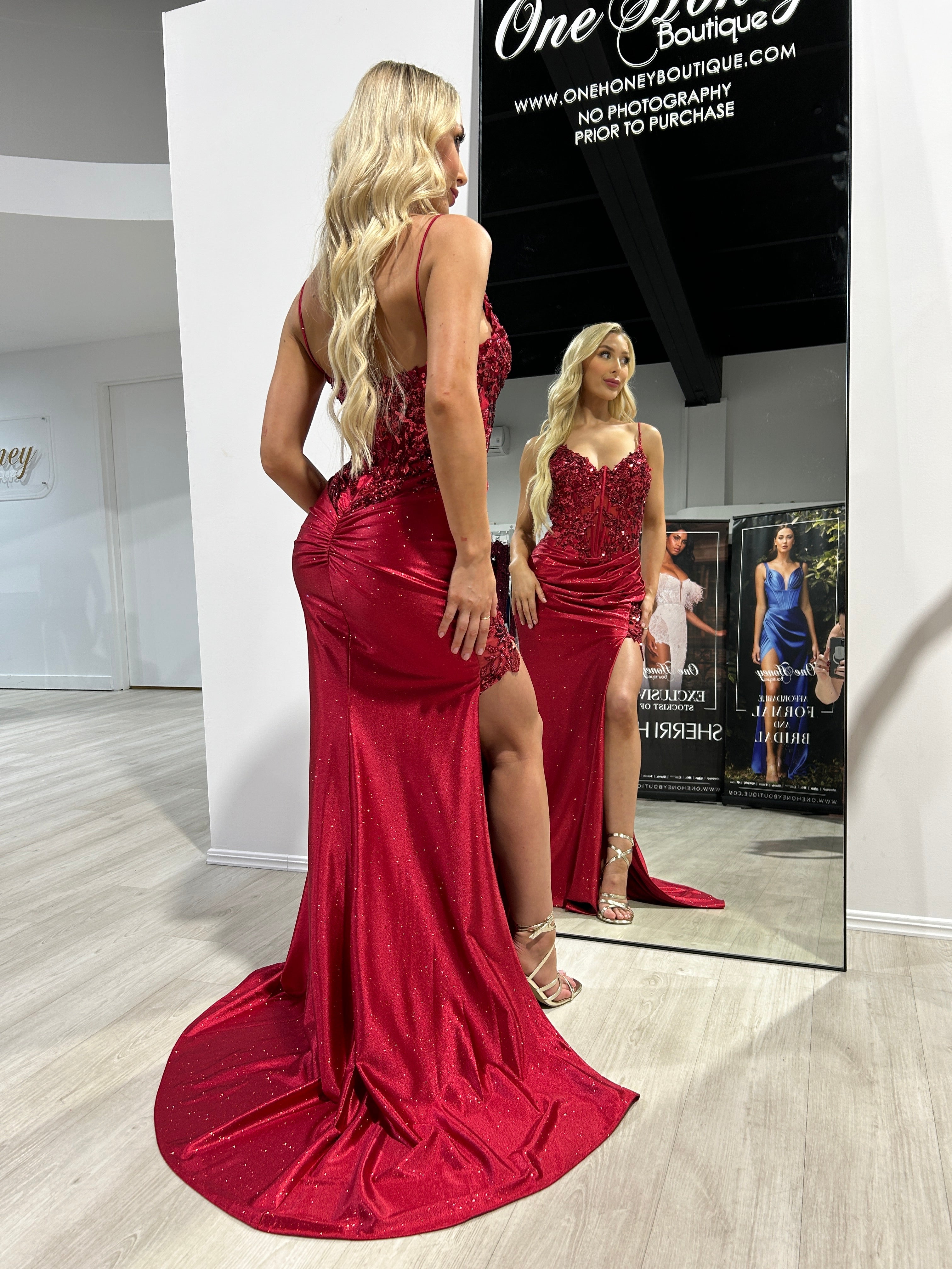 ODESSA Embellished red glitter satin mermaid evening gown with lace bodice and hip slit, reflecting in boutique mirror. Brisbane to Gold Coast, Australia