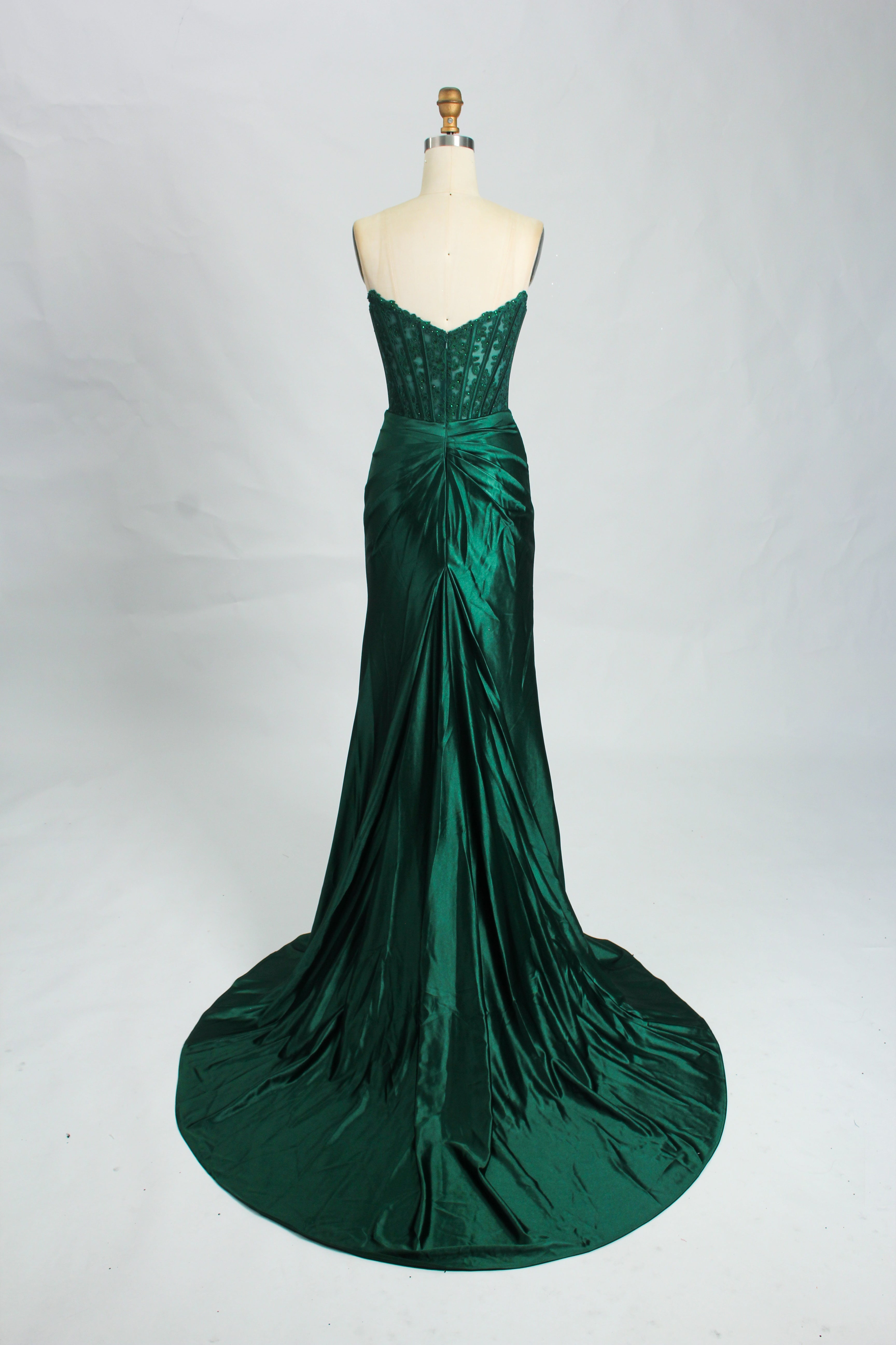 Green strapless satin mermaid formal dress by Honey Couture, emphasizing an elegant silhouette. Suitable for proms and evening events.