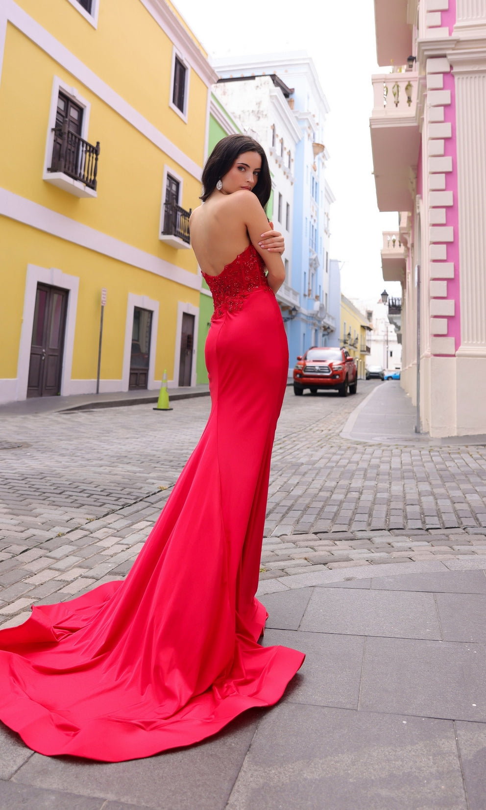 NESSA red beaded bustier strapless mermaid dress with floral embellishments on cobblestone street, perfect for prom, Brisbane to Gold Coast.