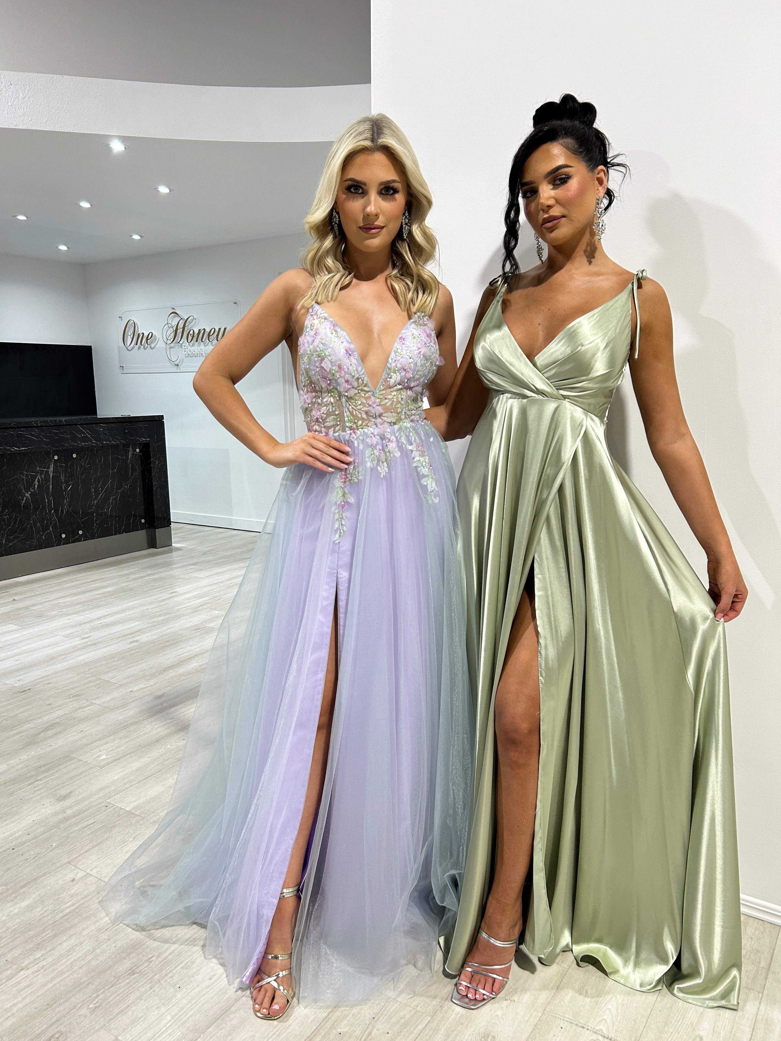 VANDA Lavender Purple Tulle A-Line Formal Dress with floral appliqués beside a satin slit green gown, Brisbane to Gold Coast.