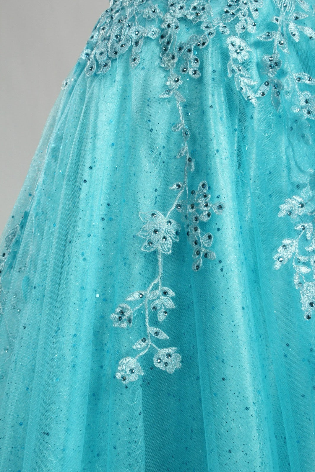Honey Couture KAELA turquoise lace tulle prom dress close-up, featuring intricate floral detailing from Australian Formal Store.