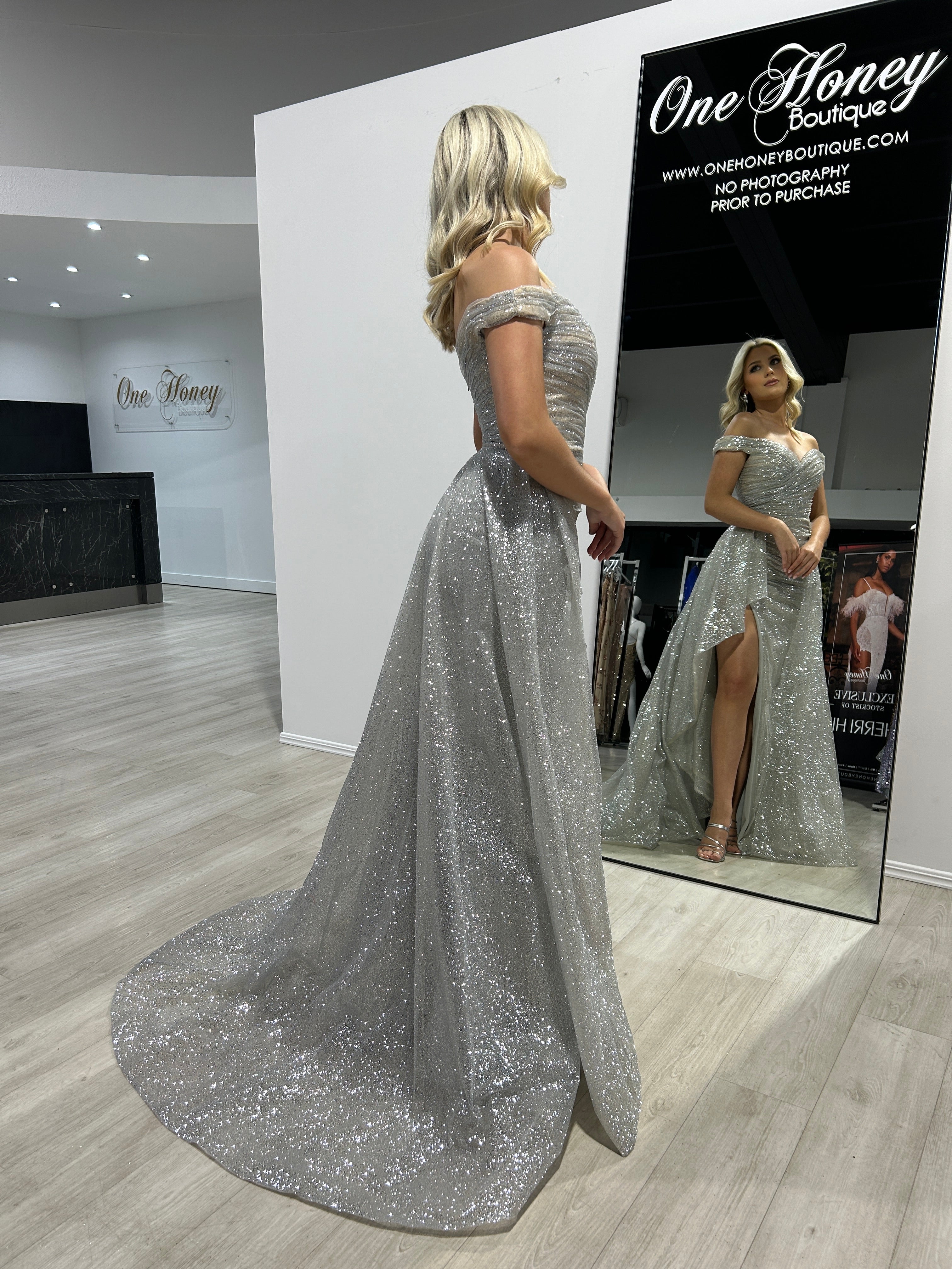 BEBE Glitter Off The Shoulder Overskirt formal dress featuring shimmering silver fabric and fitted silhouette, Brisbane to Gold Coast