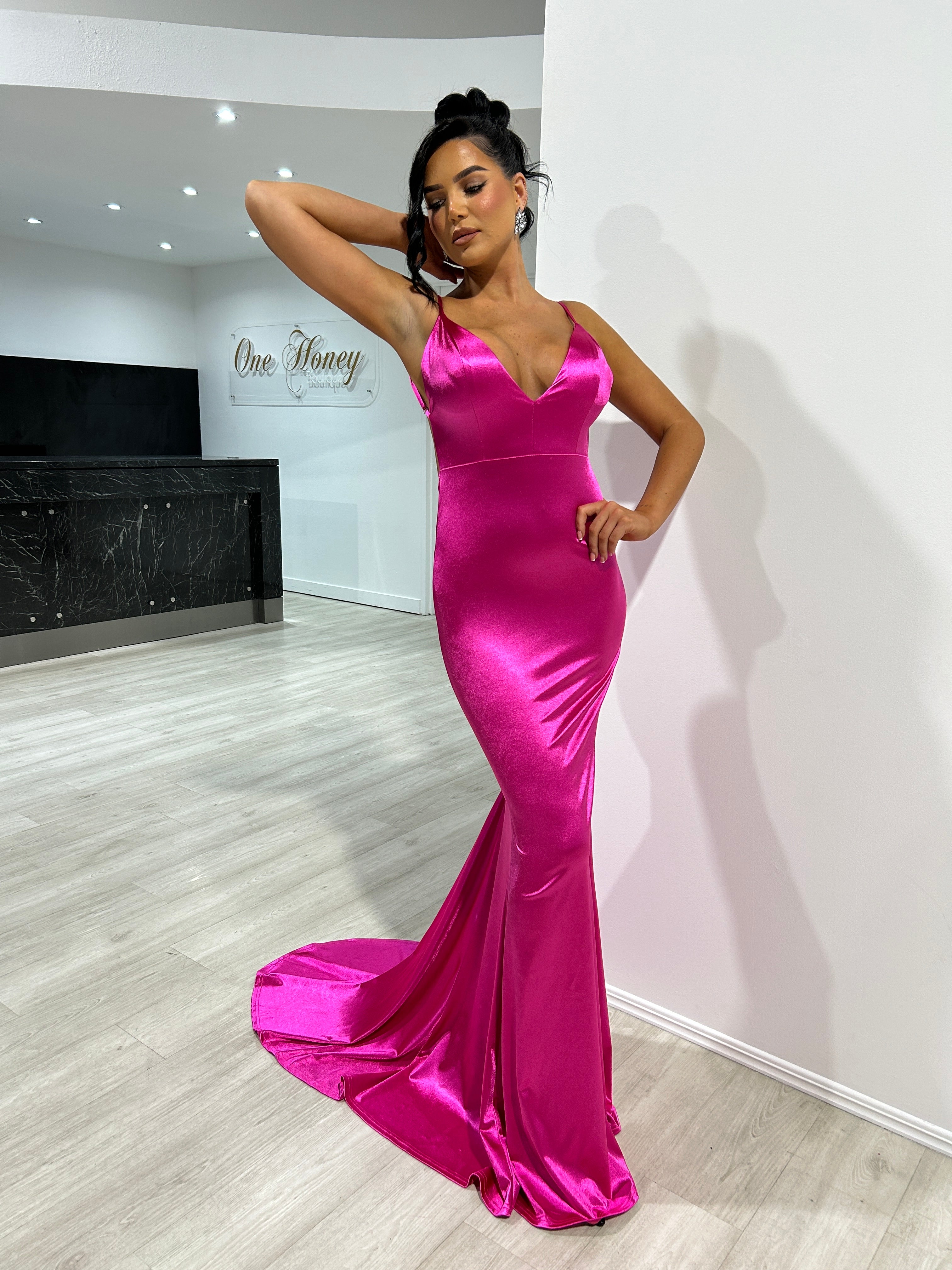 Woman wearing Honey Couture KYLIE low back mermaid evening gown, pink, from Australian designer. Ideal for prom, affordable elegance.