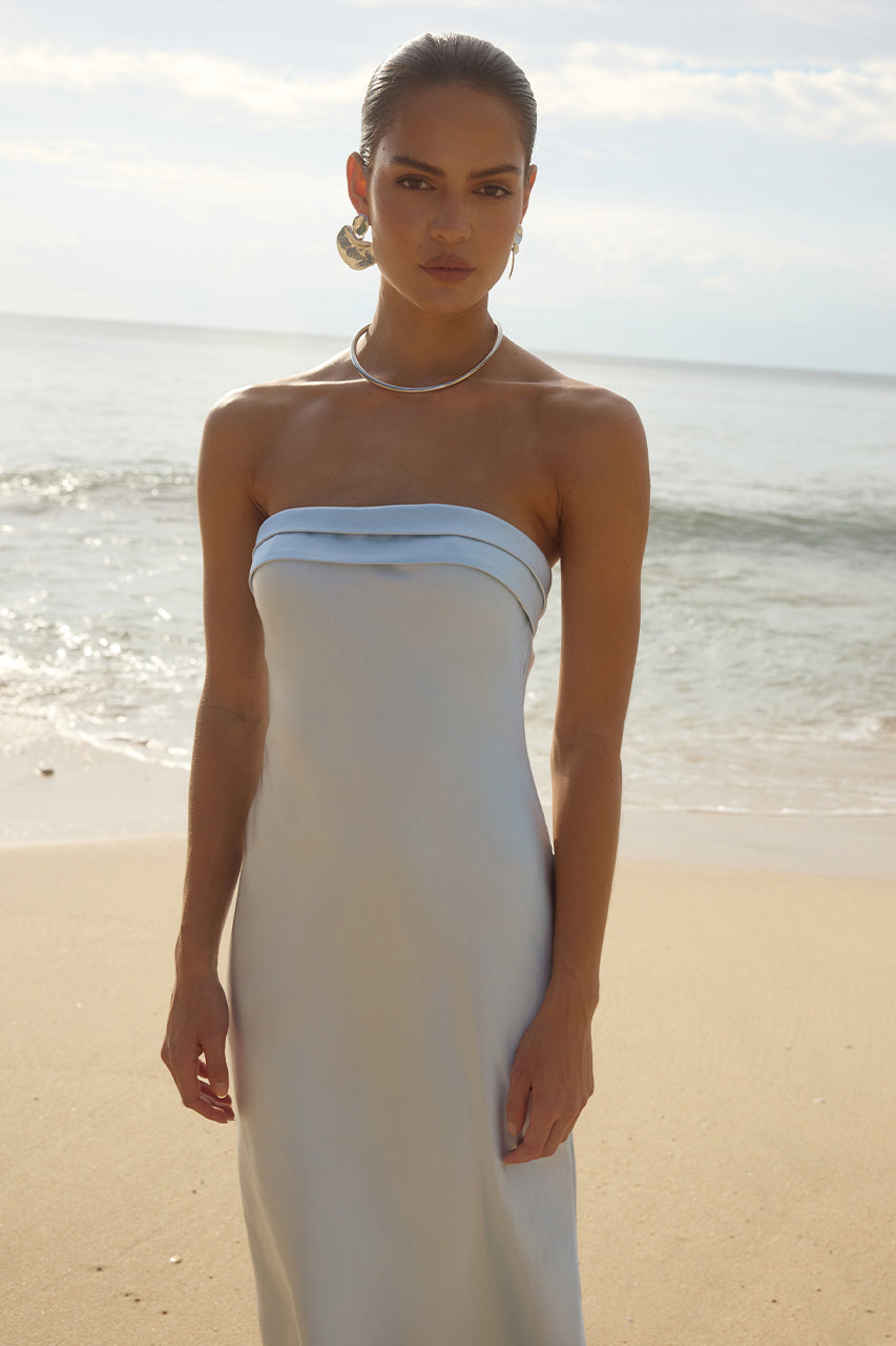 Runaway The Label DELILAH strapless maxi dress with folded neckline on beach. Perfect evening gown for Brisbane to Gold Coast.