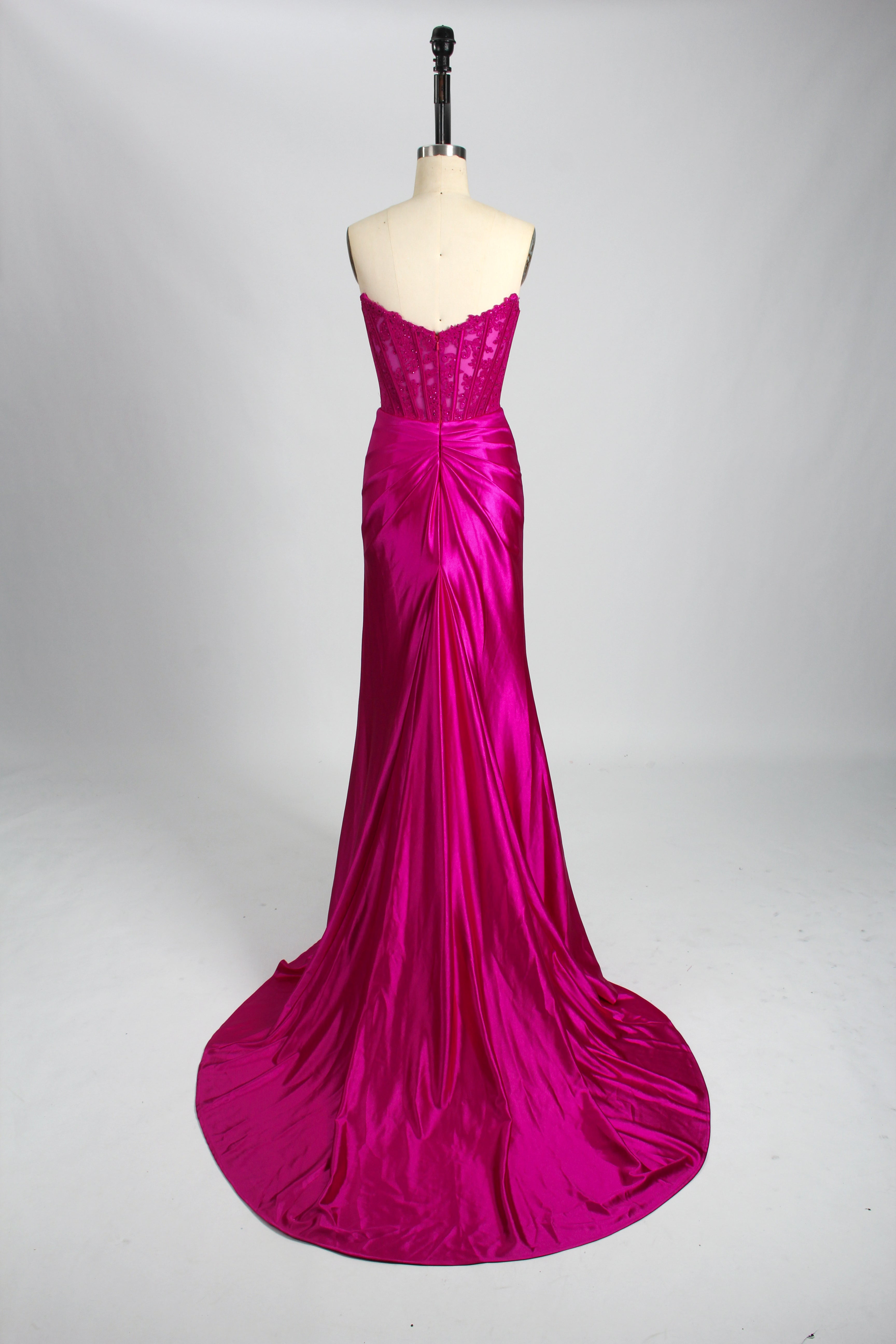 Back view of pink strapless satin mermaid formal dress on mannequin, featuring embellished bustier design, by Honey Couture.