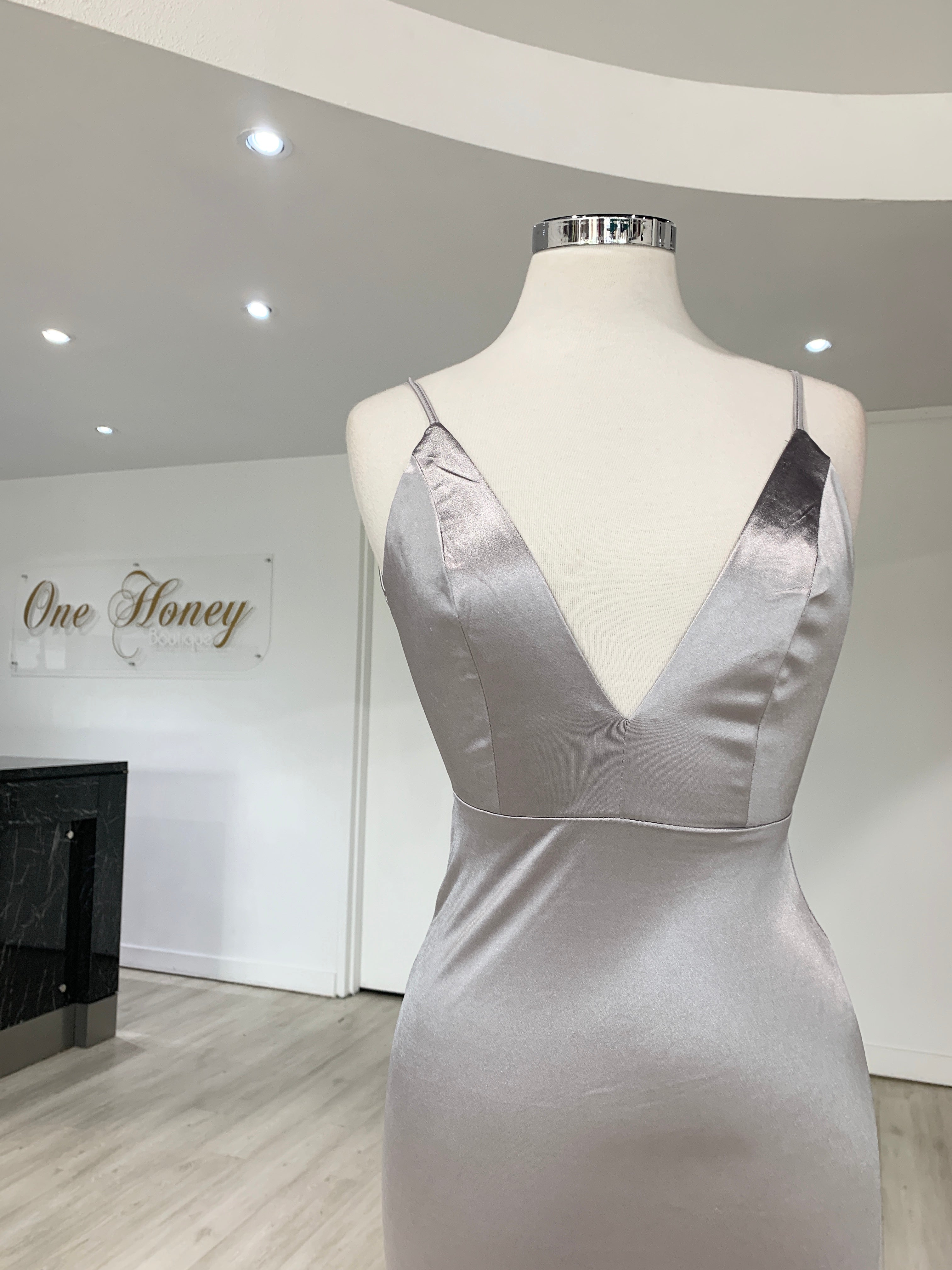 Back view of Honey Couture MILEE Low Back Mermaid Evening Gown in silky stretch fabric, highlighting elegant design and adjustable straps.