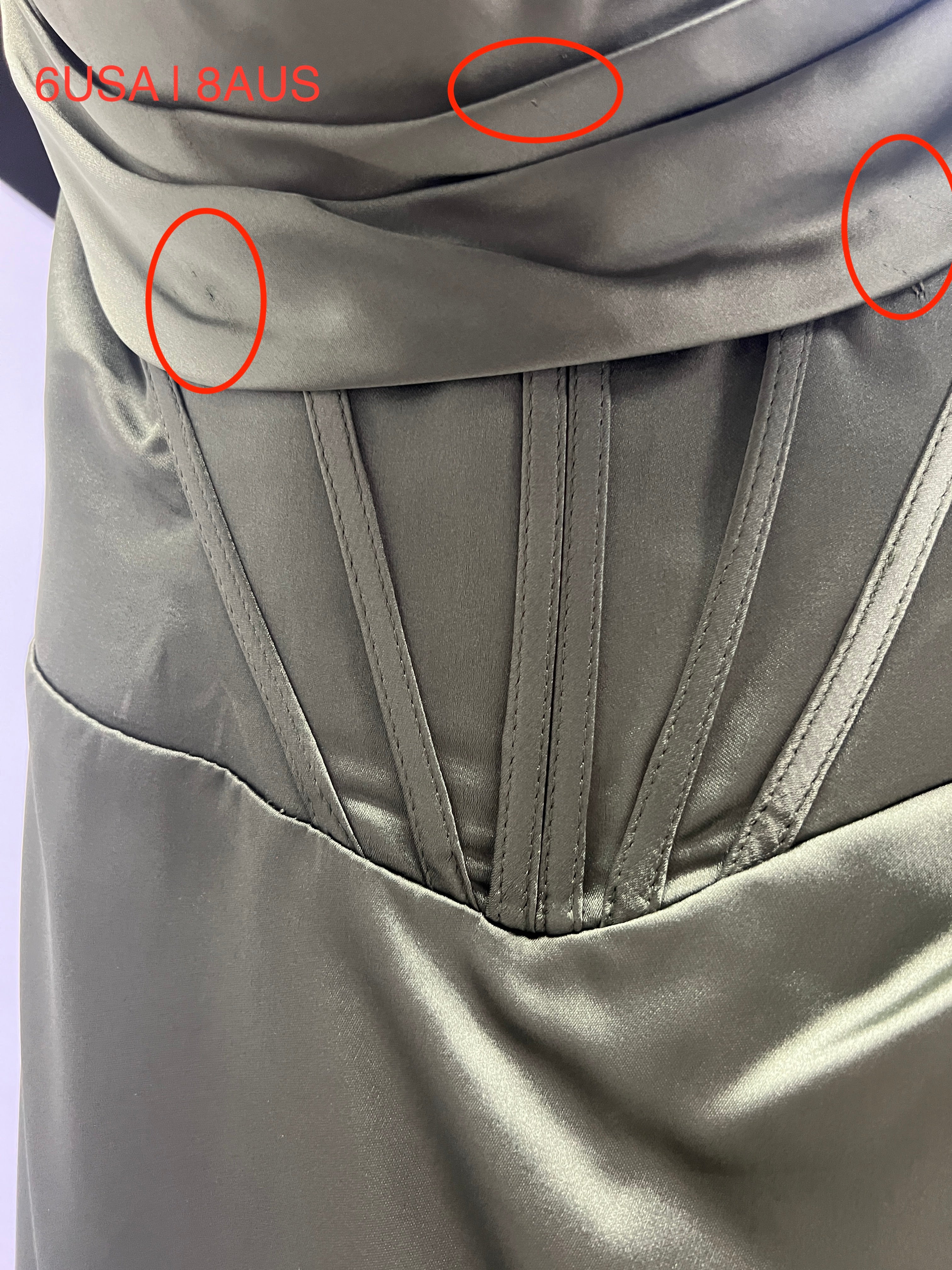 Close-up of Olive Green Satin Corset detailing on Honey Couture ZENDAYA dress, showing stitching and finish. Australian Designer Evening Gown.