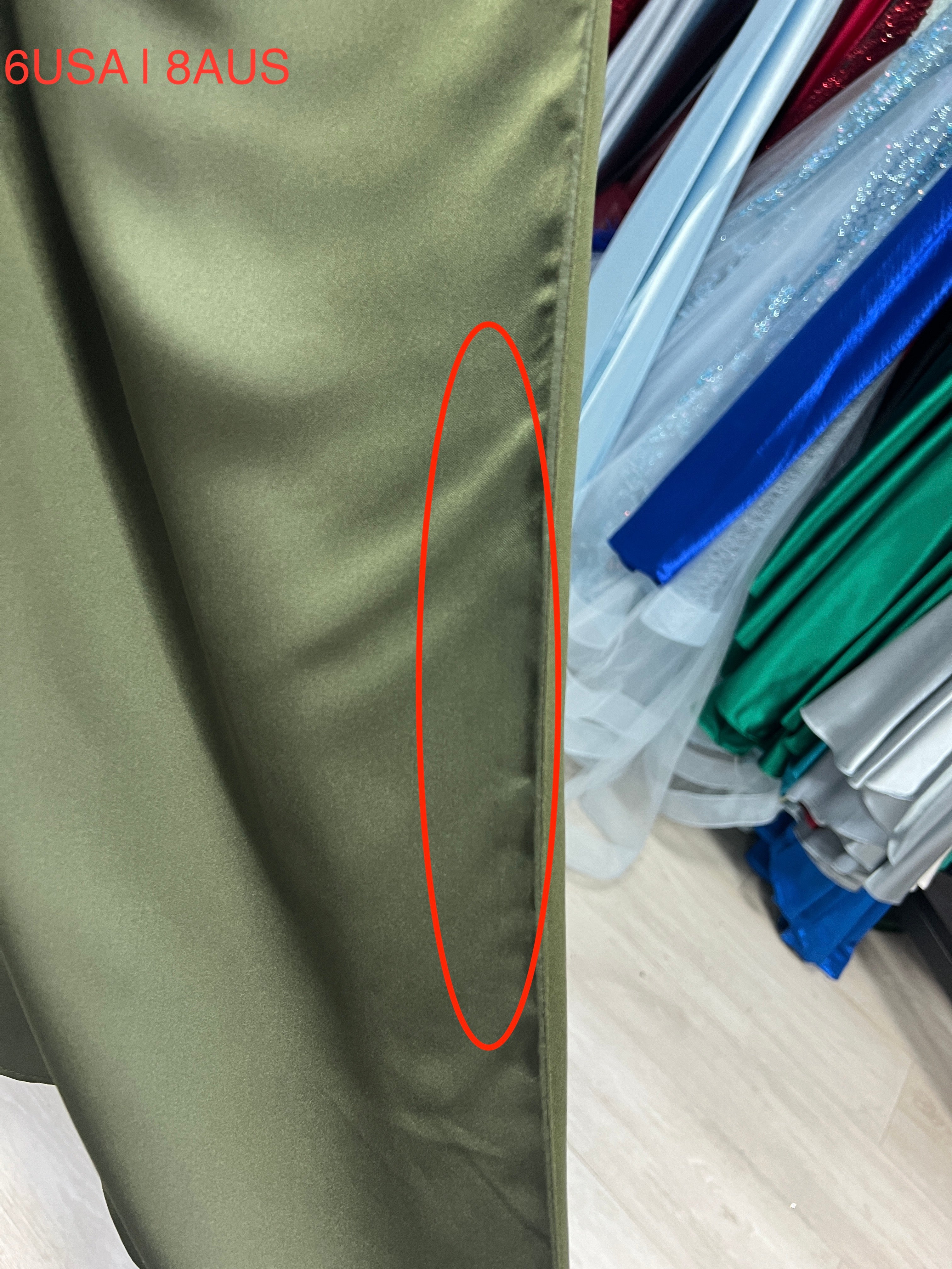 Honey Couture ZENDAYA olive green satin dress fabric detail showing leg split design.