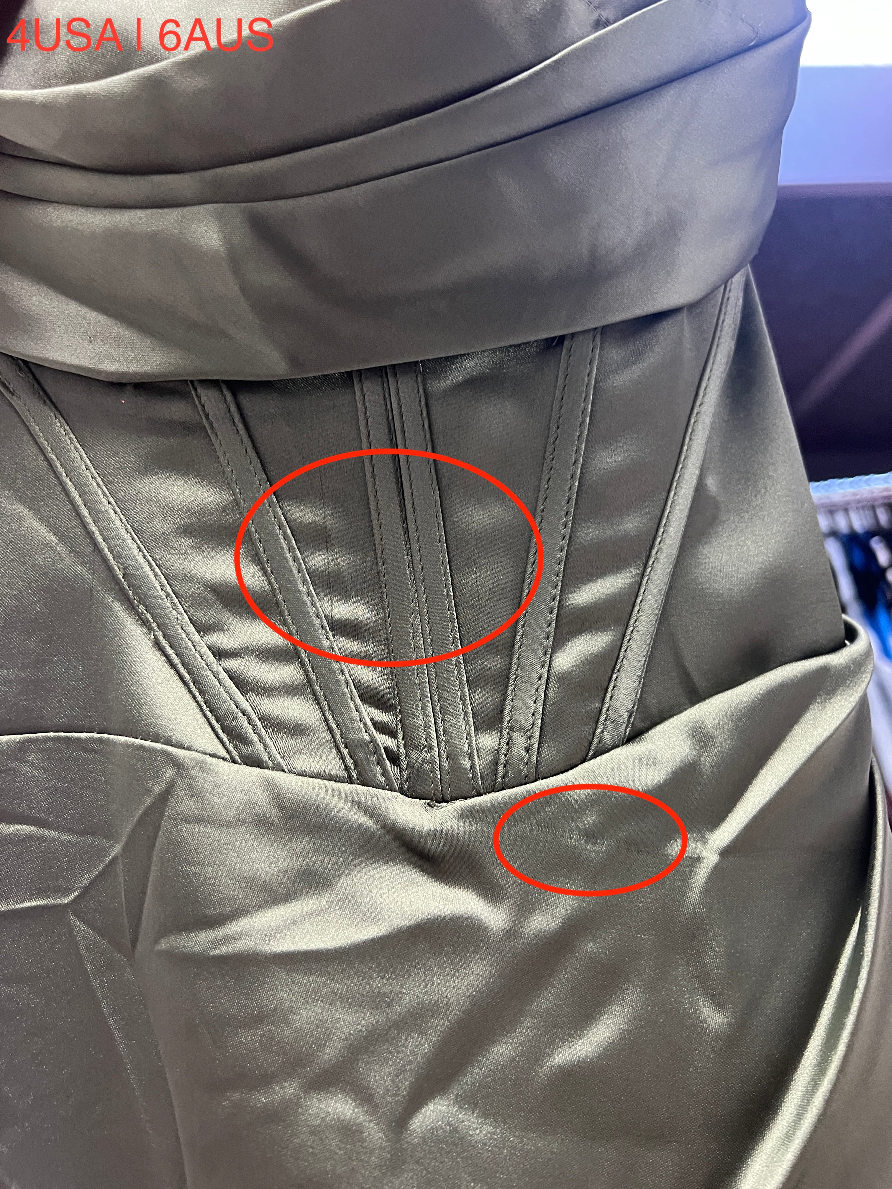 Close-up of Honey Couture ZENDAYA Olive Green Satin Corset detail on formal dress, featuring hidden corset and sleek satin finish.