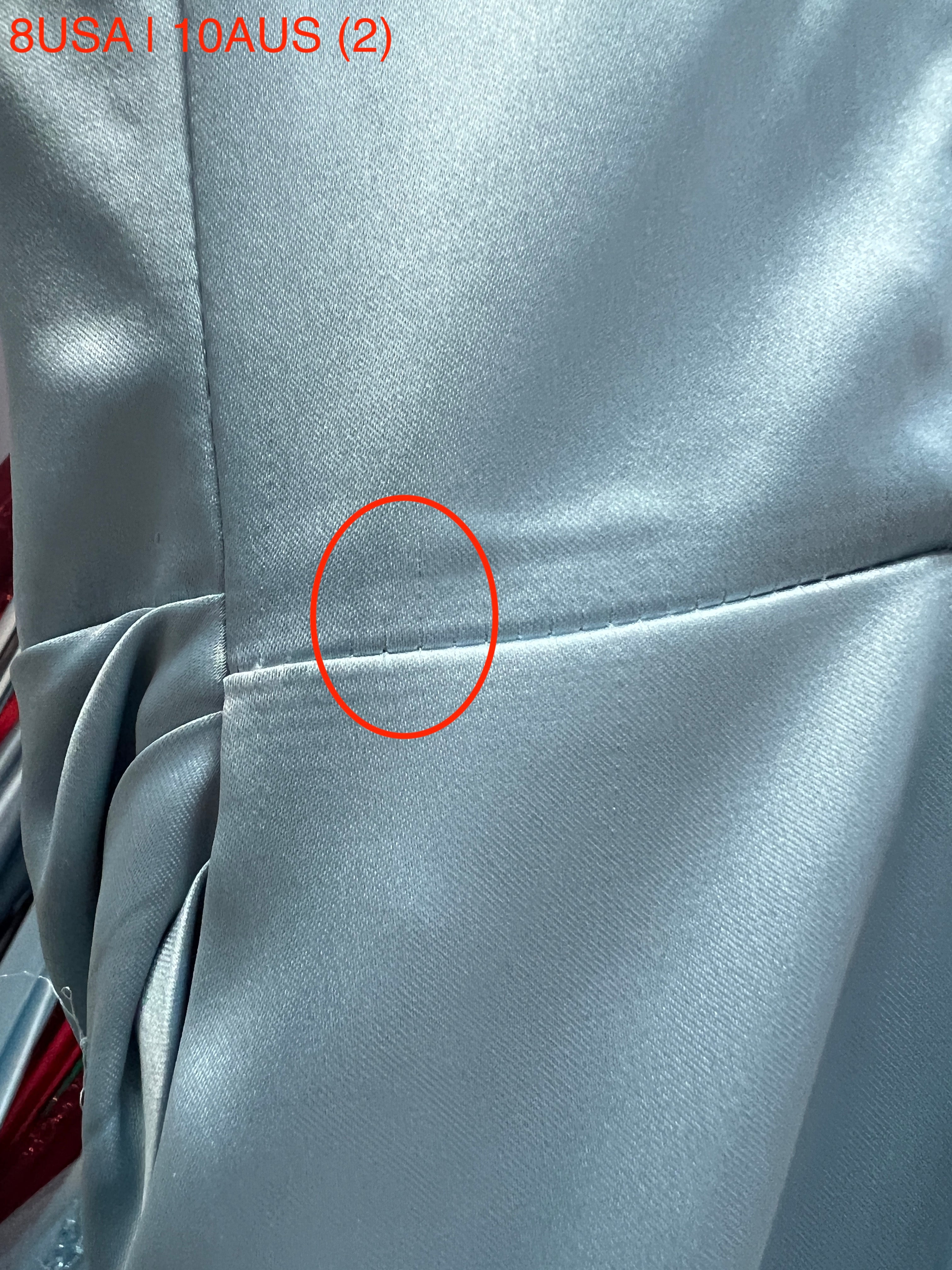 Close-up of stitching detail on Honey Couture ZENDAYA Light Blue Satin Formal Dress, showcasing fine craftsmanship and fabric quality.