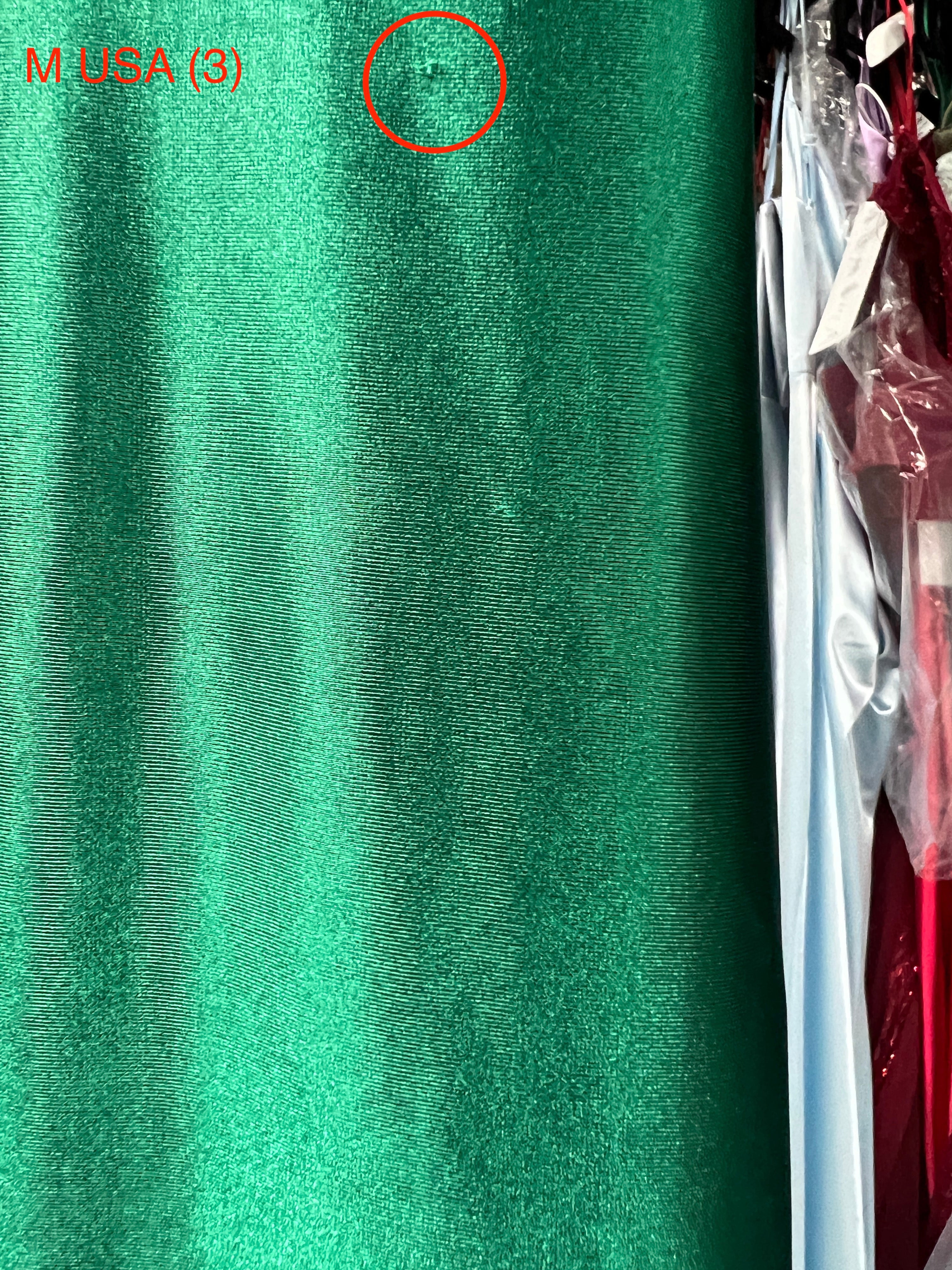 Emerald green silky fabric detail of Honey Couture SHARYN dress, highlighting texture and fabric quality for prom or formal events.