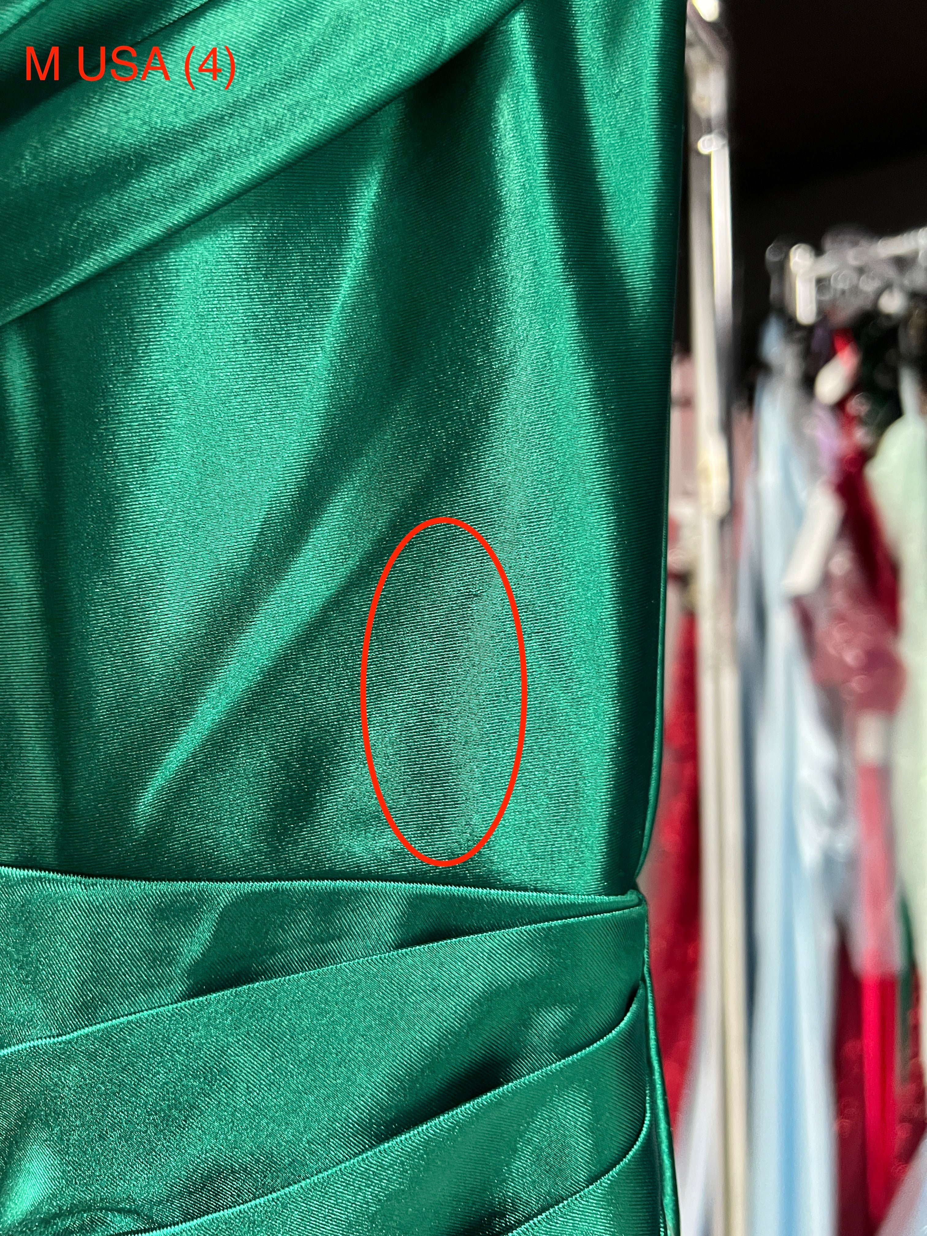 Close-up of the SHARYN Emerald Green Silky Corset Evening Dress fabric detail.