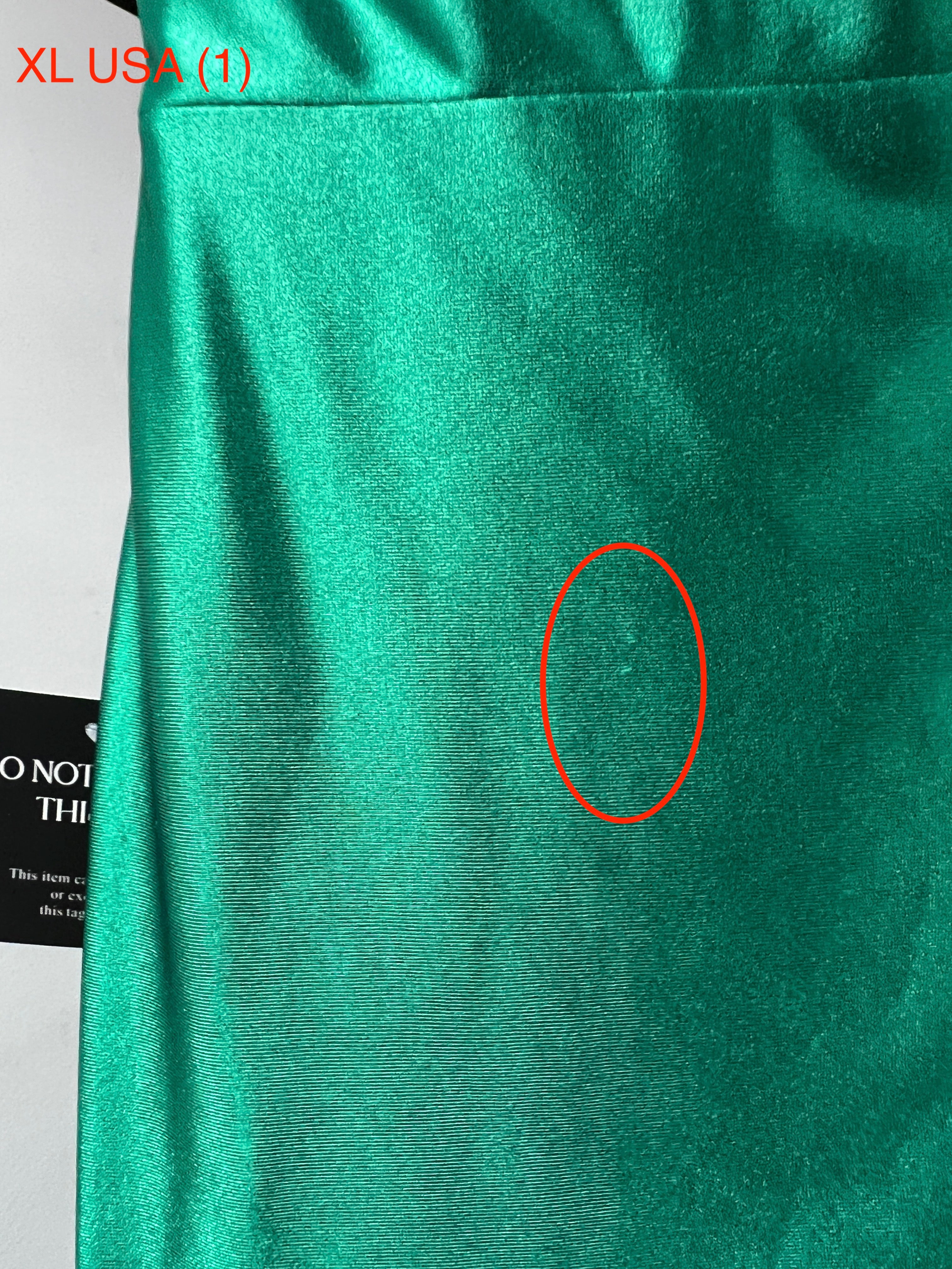 Close-up of Honey Couture SHARYN Emerald Green Silky Dress fabric detail, showing small flaw. Ideal for prom and formal events. Affordable.