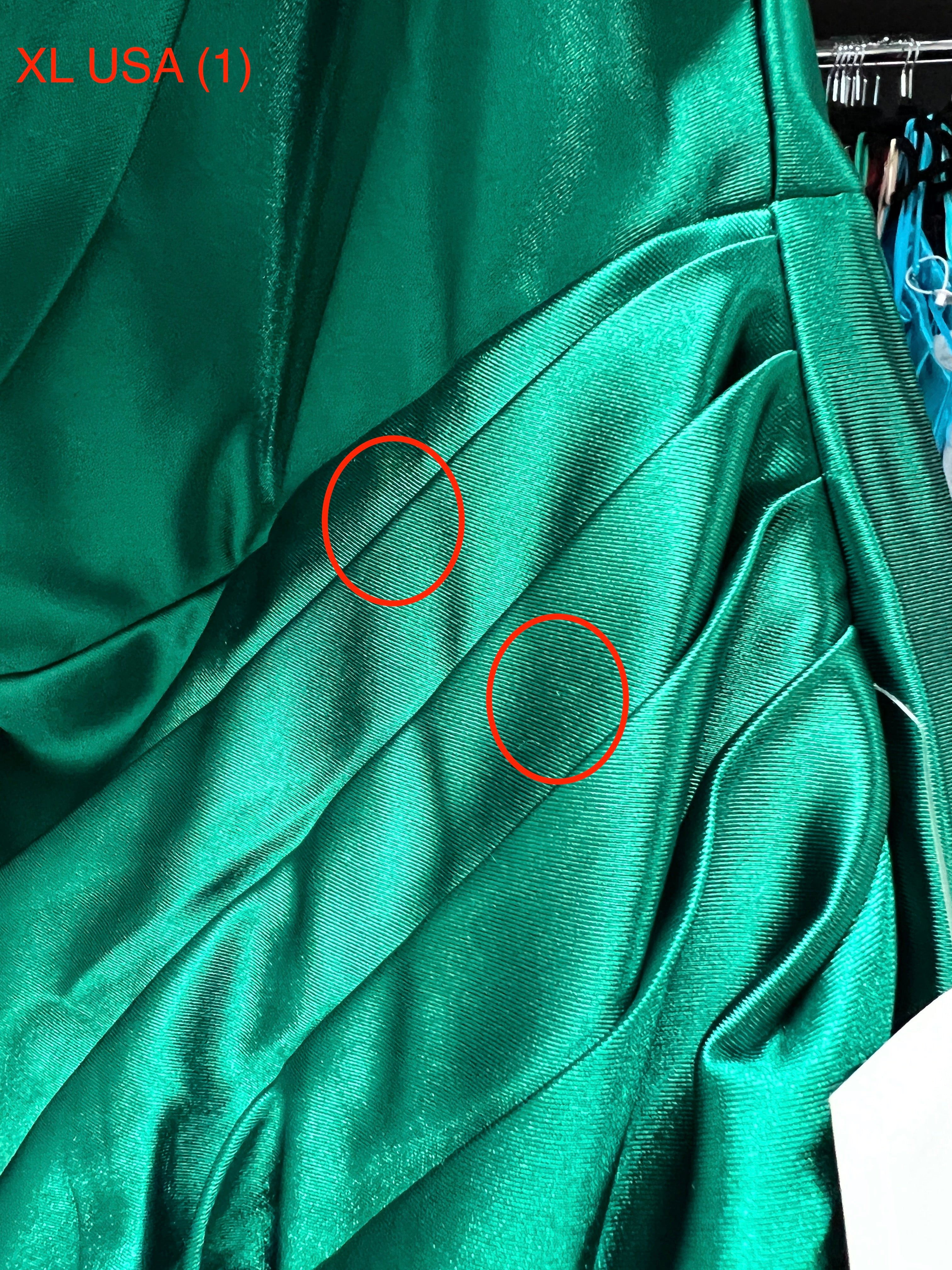 Close-up of Honey Couture SHARYN Emerald Green silky mermaid dress with ruched detailing, showing XL USA size label.