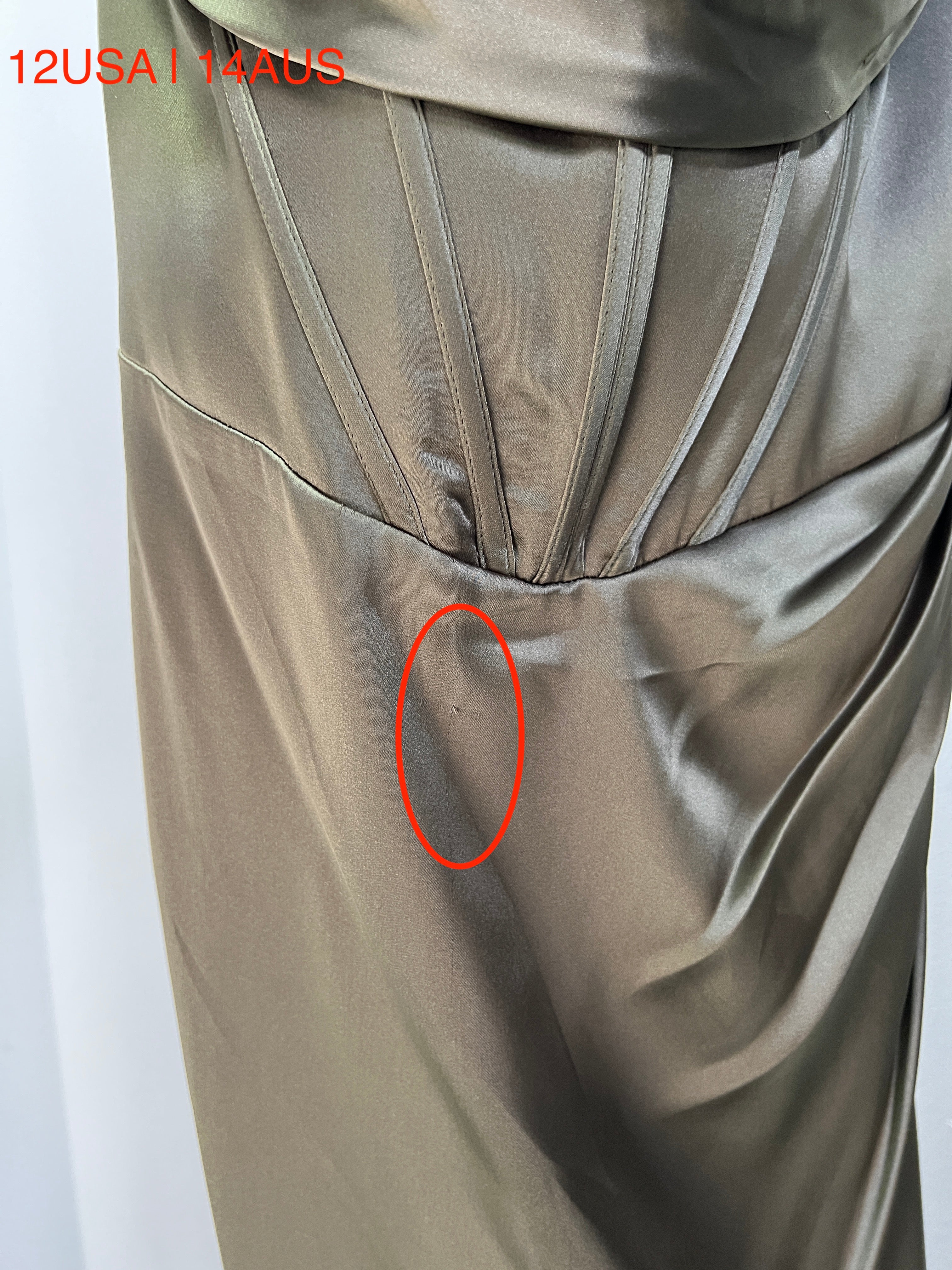 Close-up of Honey Couture ZENDAYA Olive Green Satin Corset Bustier Dress with visible fabric flaw, size 12USA/14AUS, Prom Dress, Australian Designer.