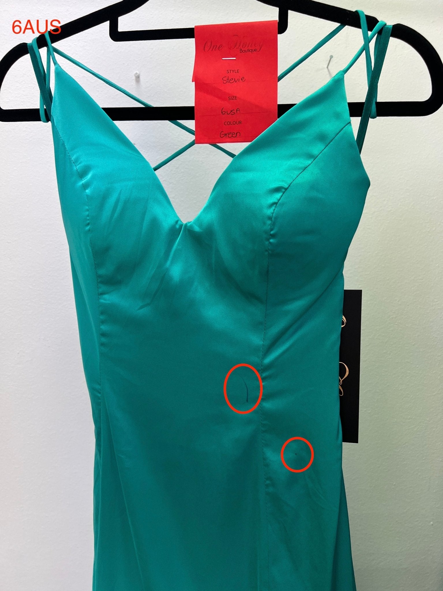 Turquoise satin V-front dress on hanger, visible tags, size 6 AUS, Honey Couture, Australian Designer, showcasing evening gown details.