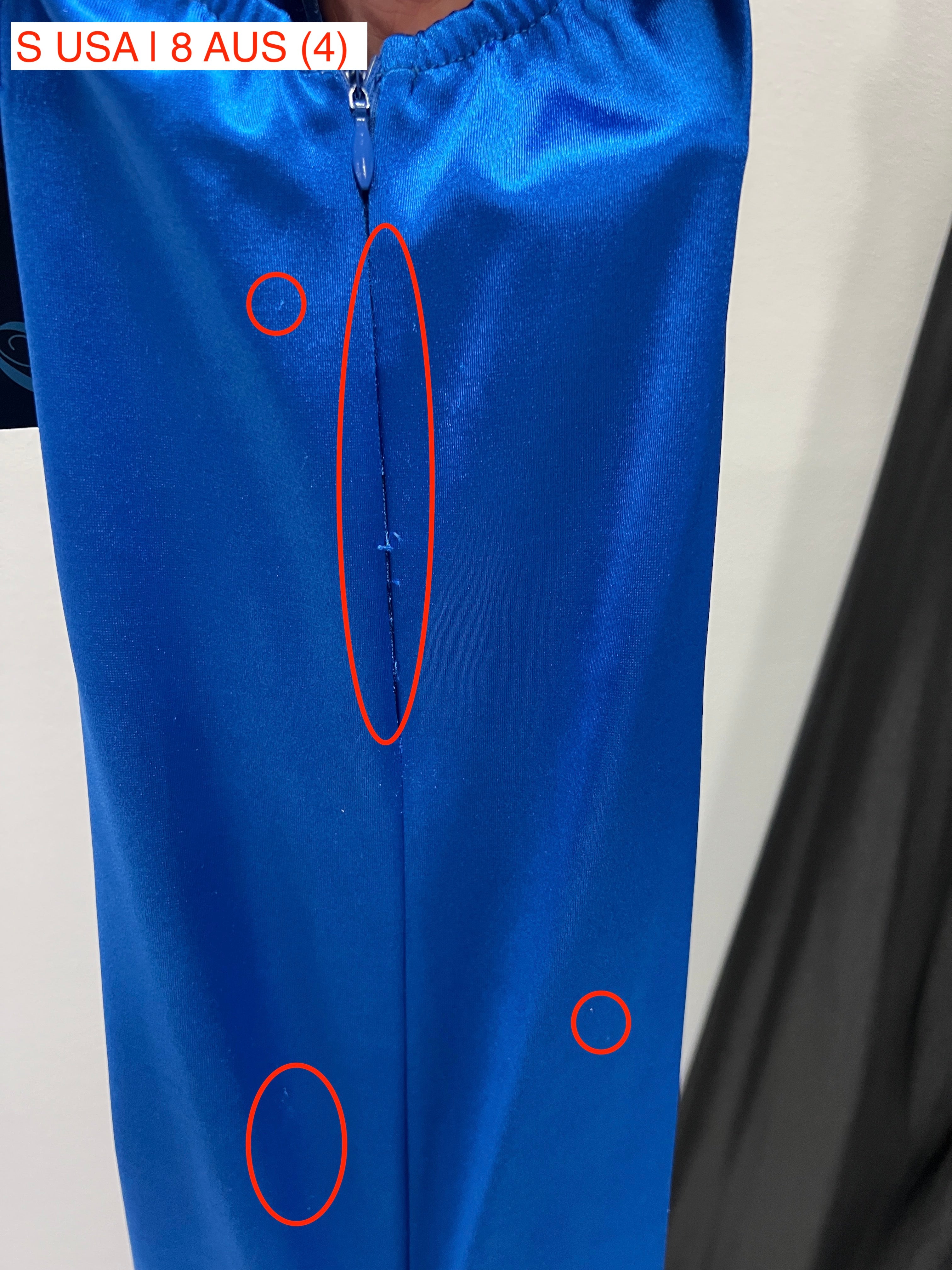 Close-up of blue mermaid gown fabric with highlighted stitching details, size S USA/8 AUS. Honey Couture Australian Designer Dress.