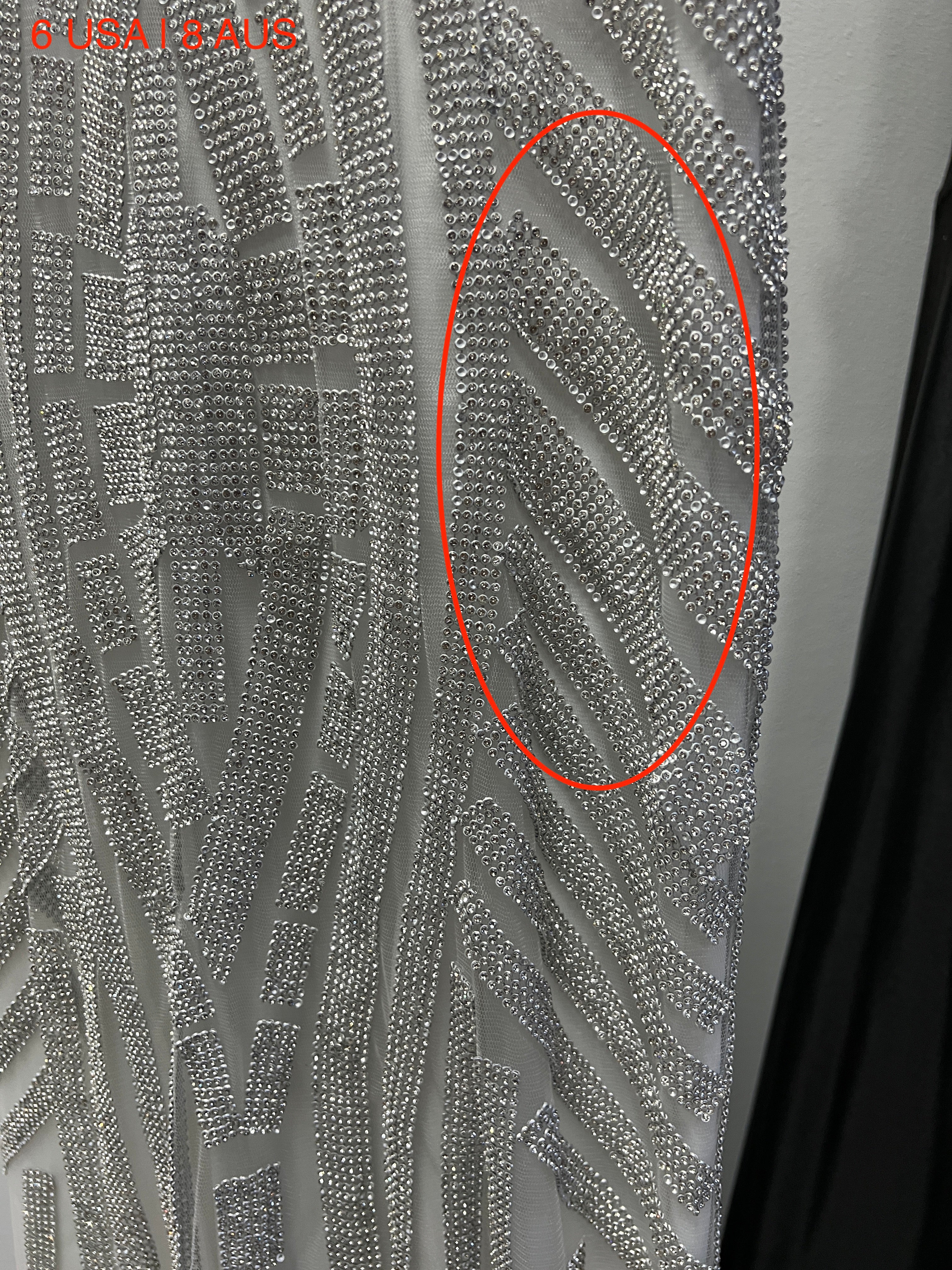 Close-up of sequined fabric on Honey Couture DIAMONDS white mermaid gown, showcasing luxury Australian designer style for prom and evening events.