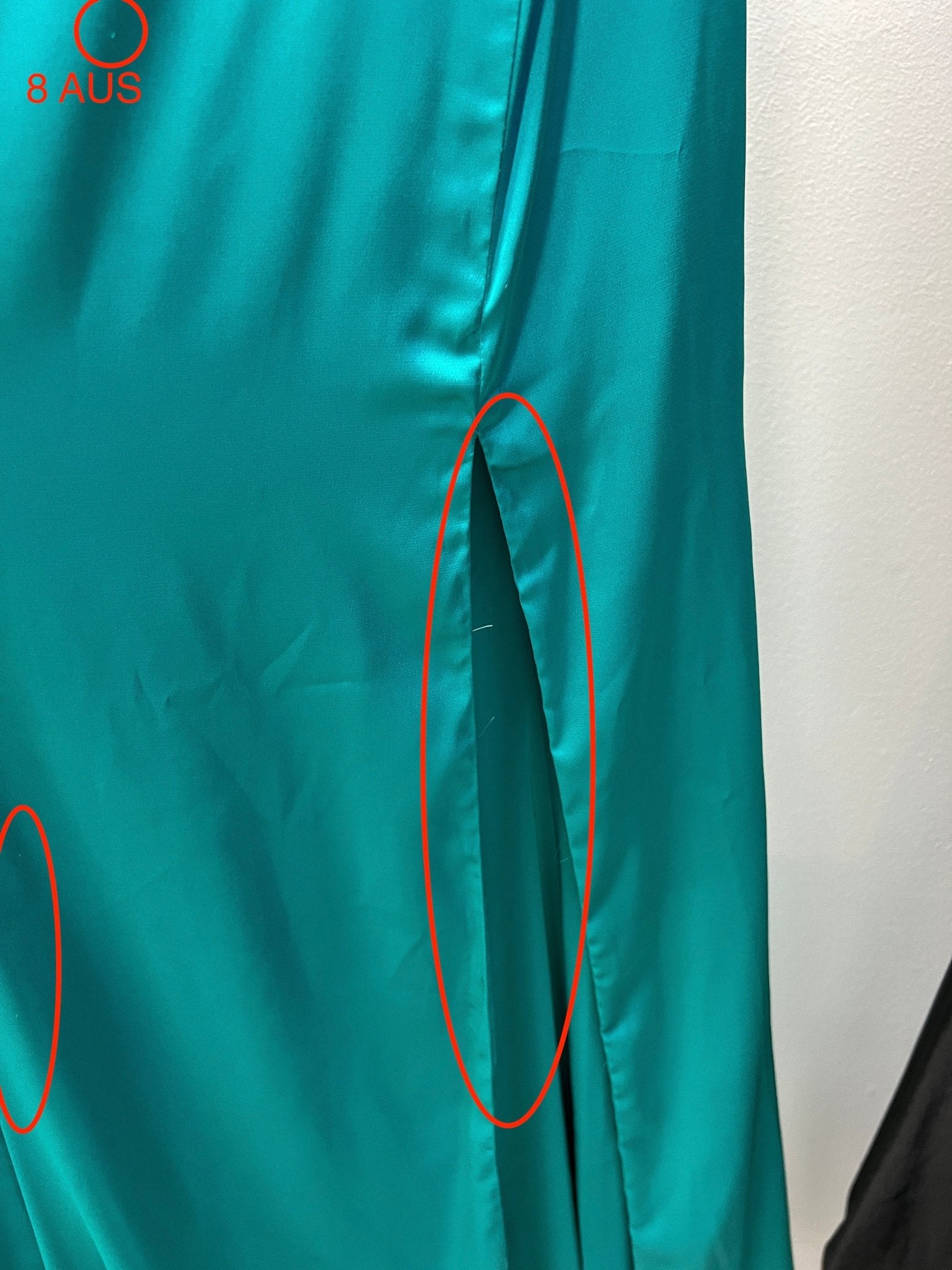 Close-up of turquoise STEVIE formal dress fabric detail with potential flaw, designed by Honey Couture, Australian Designer, affordable evening gown.