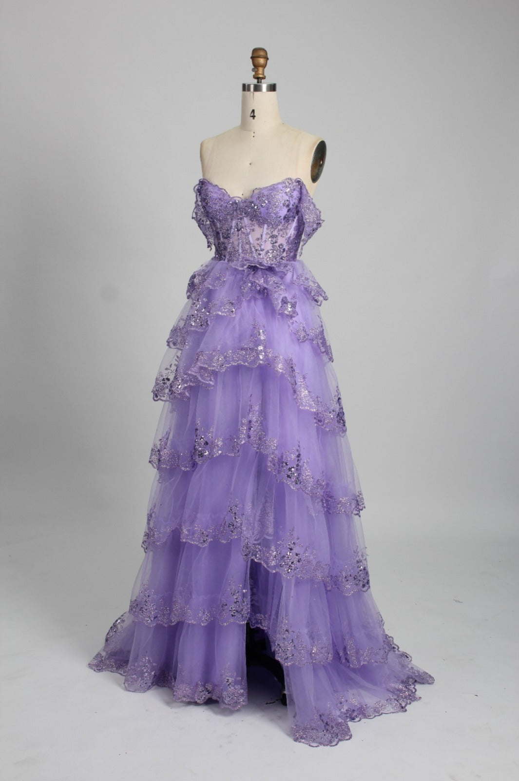 Lavender layered tulle ball gown on mannequin, Honey Couture NATASHA, off-shoulder style, Australian designer prom dress, affordable evening gown.