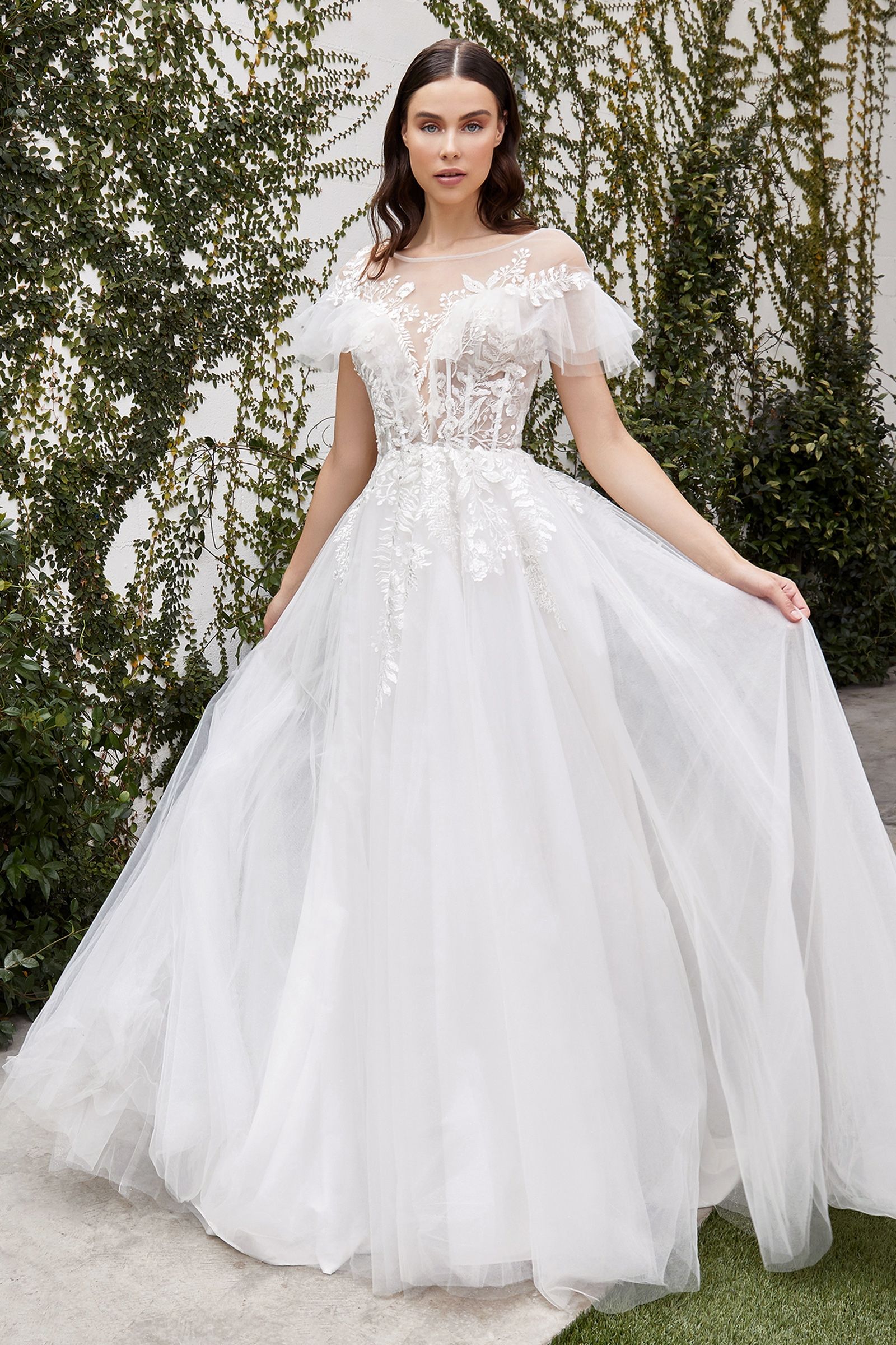 Divinity Bridal ELENI wedding dress with cap sleeves, sheer boned corset, and lace tulle for affordable bridal elegance.
