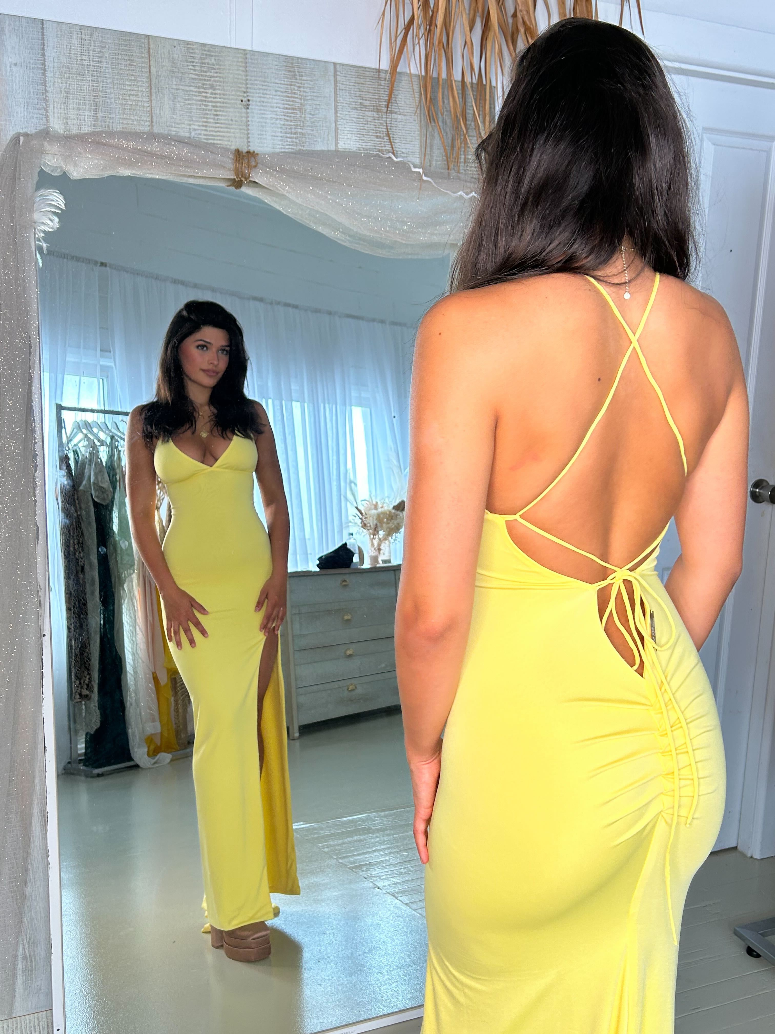 Amy Taylor KORISSA yellow mermaid dress with halter neck, bandage fabric, and corset back, featuring bodycon silhouette and leg split.