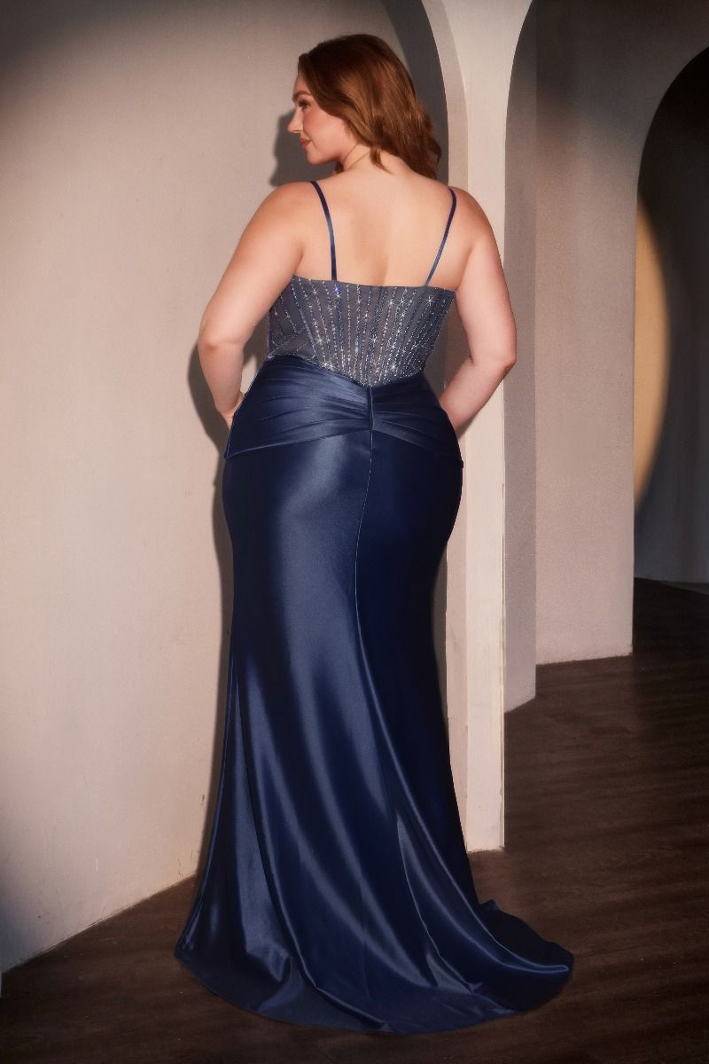 Model wearing LUCIANO Curve plus size embellished crystal bodice fitted prom dress in navy blue, featuring elegant thin straps.