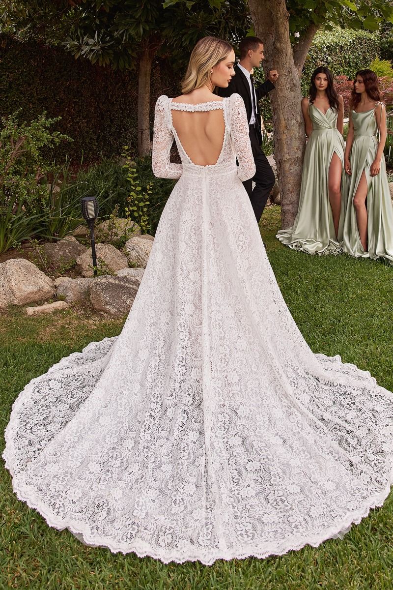 Divinity Bridal ALESSIA Boho Lace A-Line Ball Gown with removable jacket, elegant affordable bridal wedding dress in garden setting.