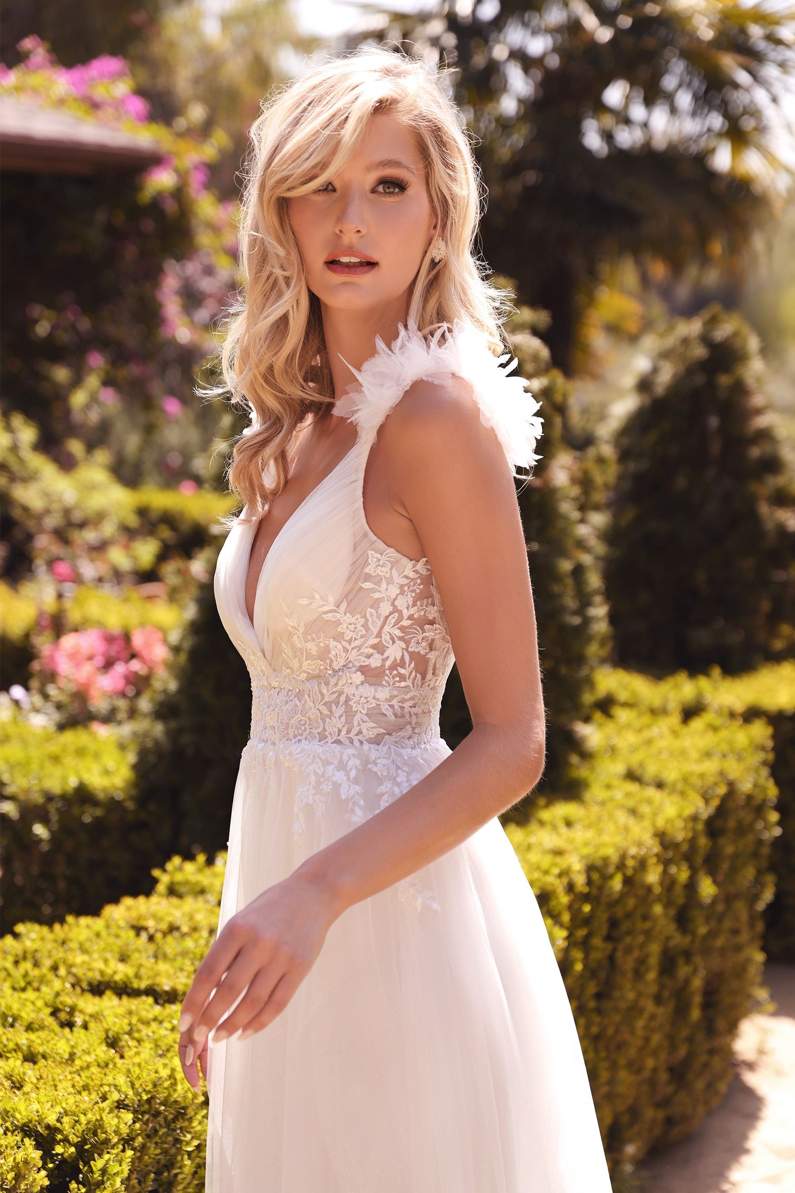 Divinity Bridal ELEONORA Cap Sleeve Bodice A-Line Wedding Dress, an affordable bridal gown with lace details and feather-like tulle straps.