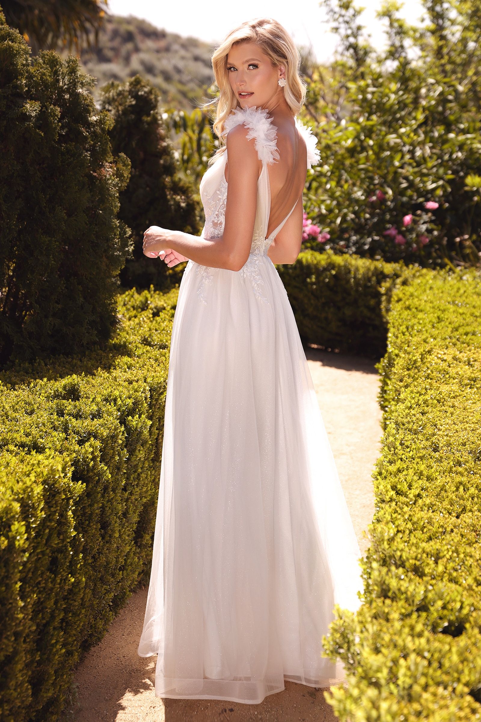 Elegant Divinity Bridal ELEONORA cap sleeve A-line wedding dress with feather accents, affordable bridal gown Australia in garden setting.