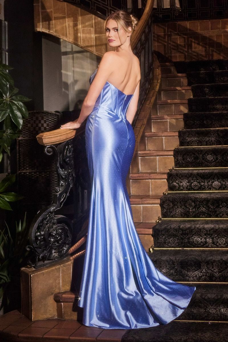A woman in a strapless blue satin evening gown with a mermaid silhouette, standing on ornate stairs. Brisbane to Gold Coast, Australia.