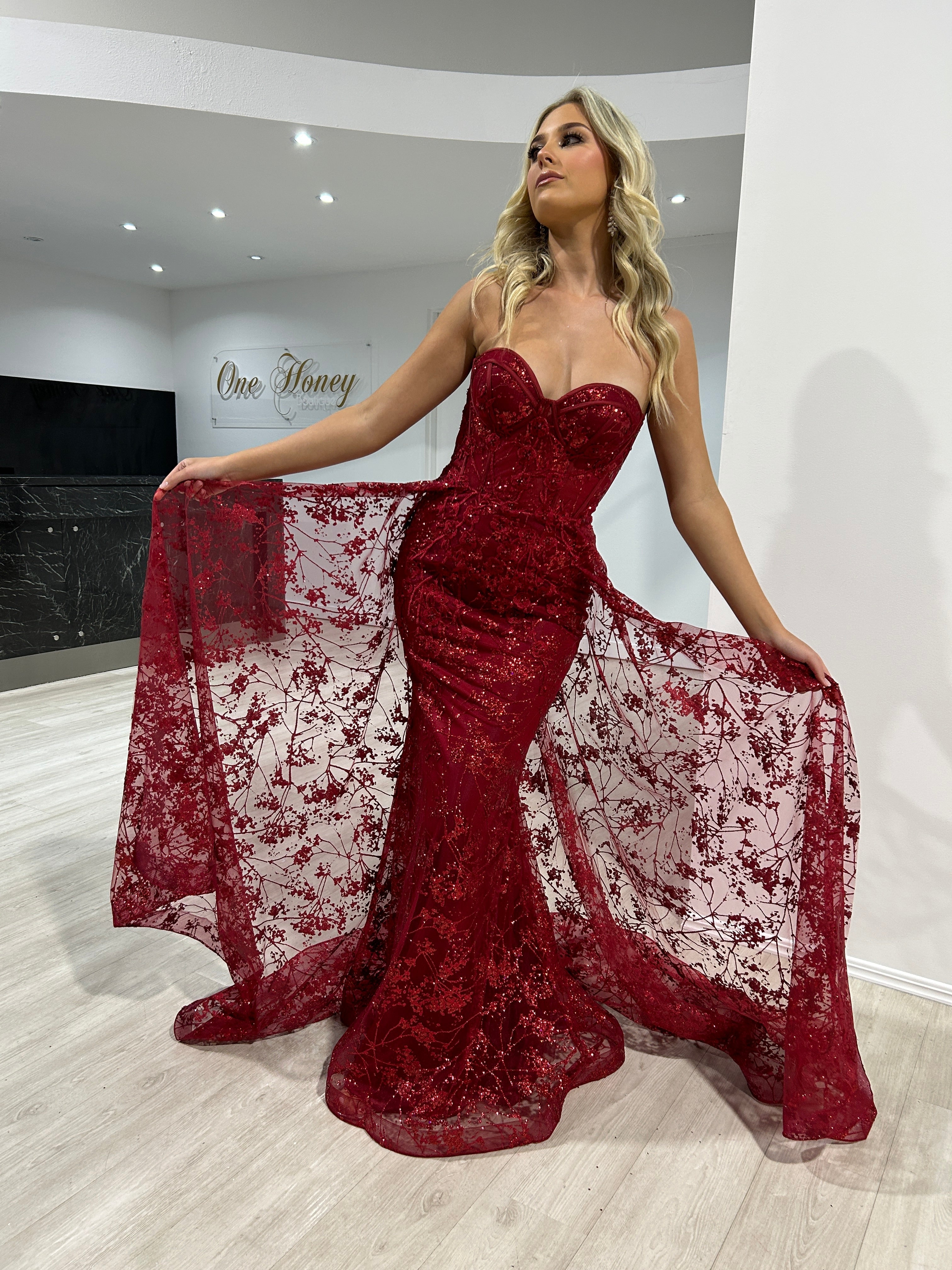 ASTRA Glitter Strapless Corset Overskirt formal dress in red. Features sparkling glitter fabric and elegant overskirt. Brisbane to Gold Coast.