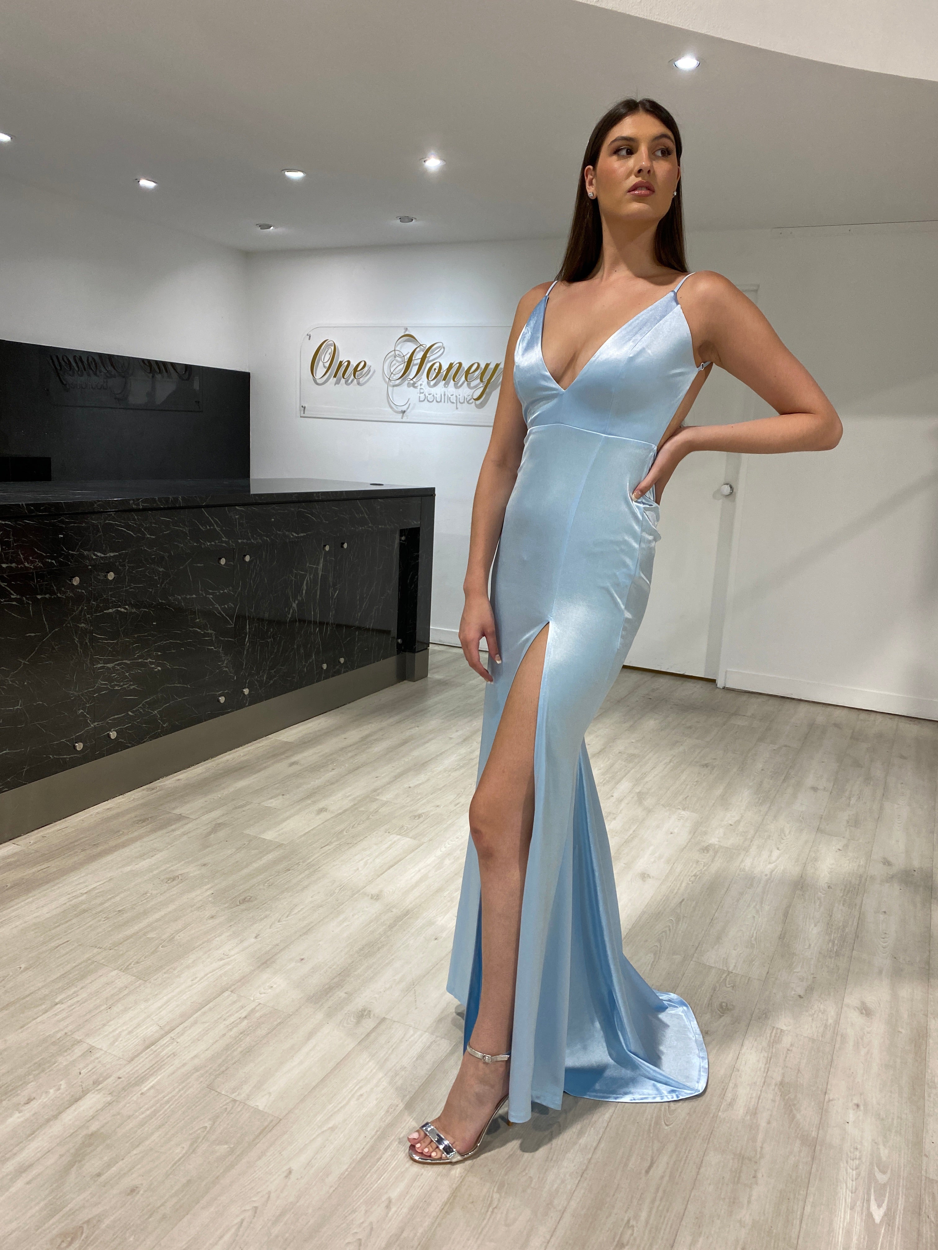 Woman wearing Honey Couture MILEE low back blue mermaid evening gown with leg split, Australian designer prom dress, elegant and affordable.