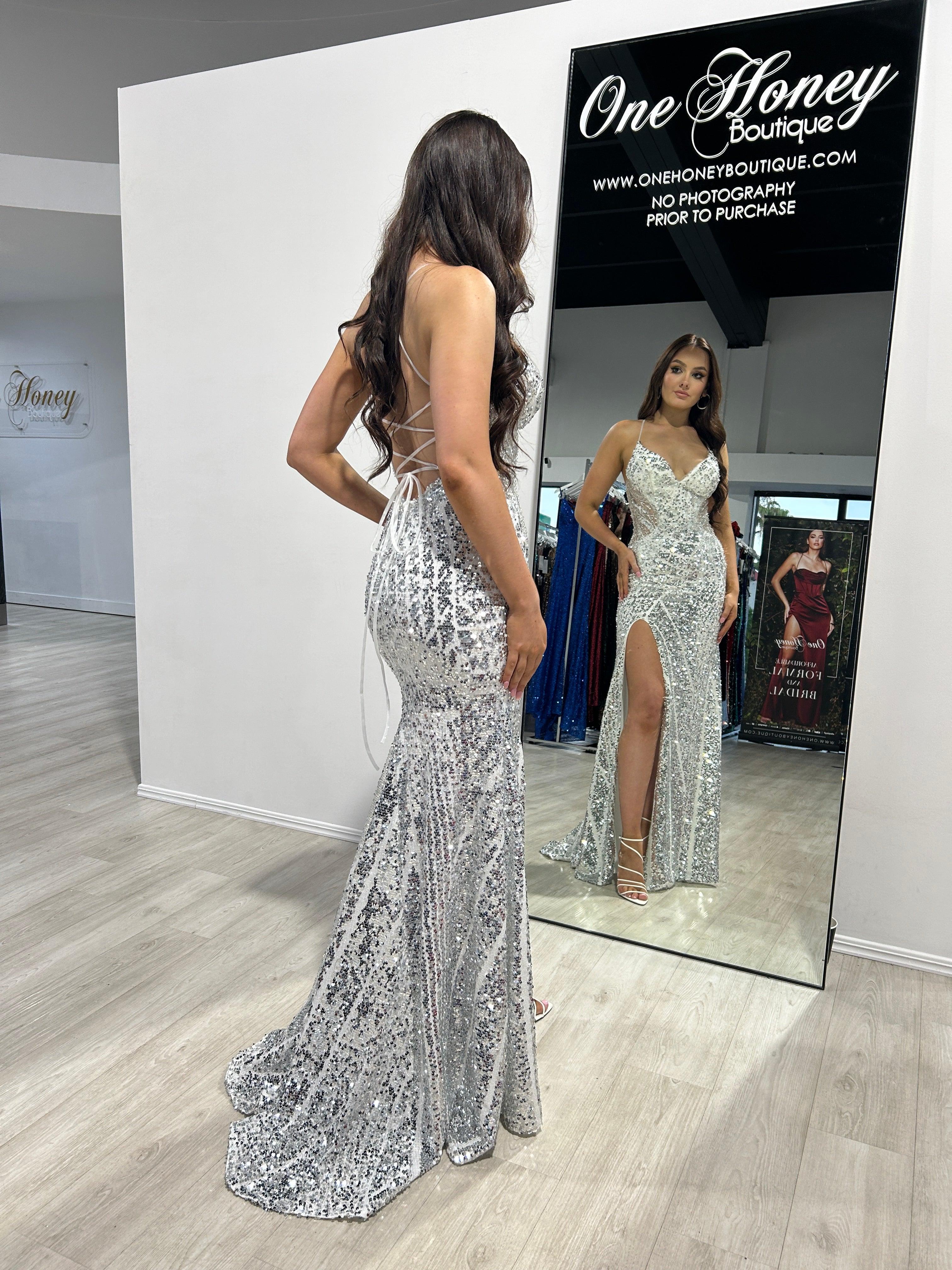 RICHIE Sequin Mermaid Evening Gown with slit, glimmering in silver sequins. Seen in a boutique mirror. Brisbane to Gold Coast.