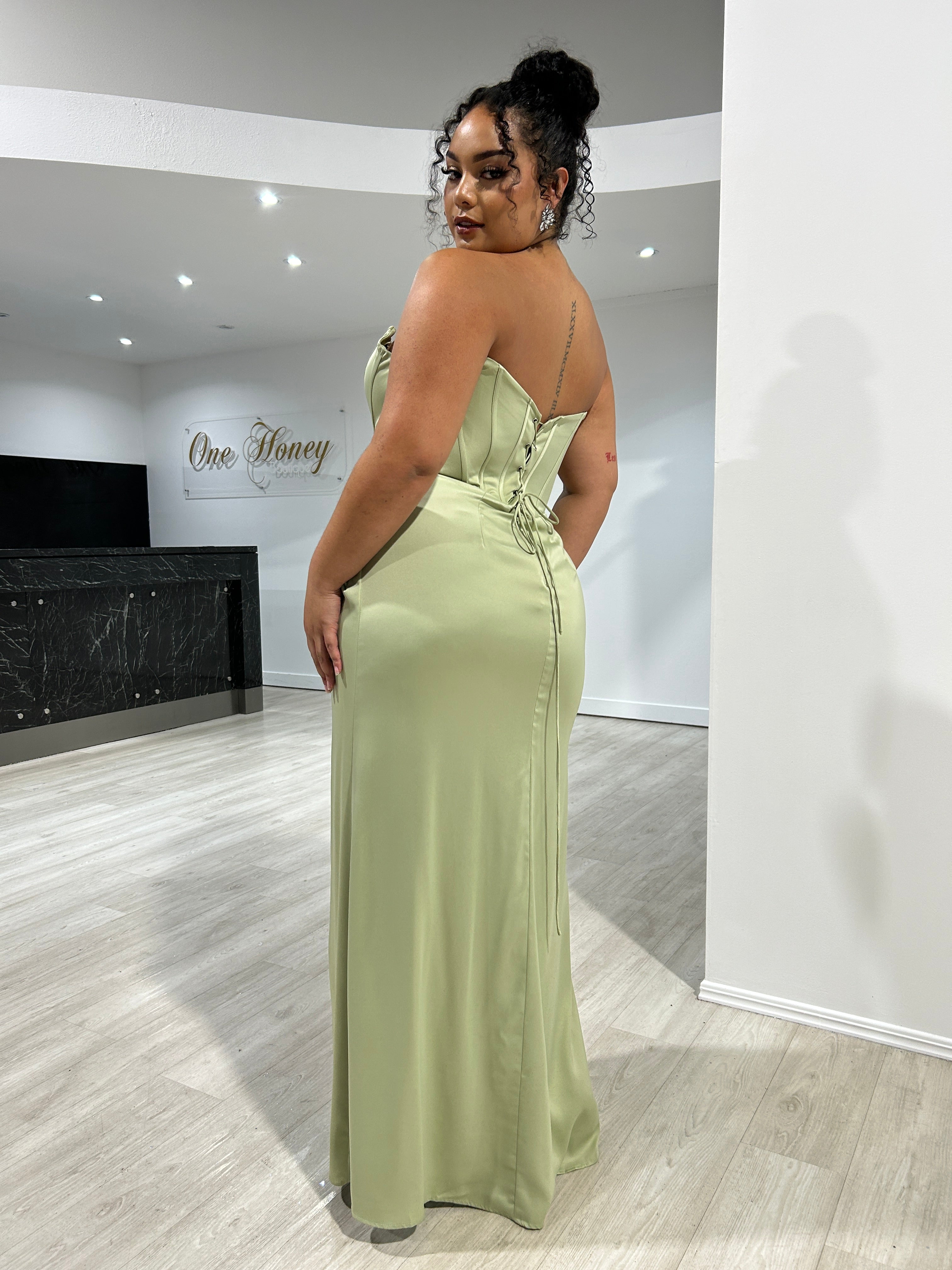 Elegant off-shoulder sage green satin gown with boned corset and adjustable tie back. Perfect for bridesmaid or prom. Brisbane to Gold Coast.