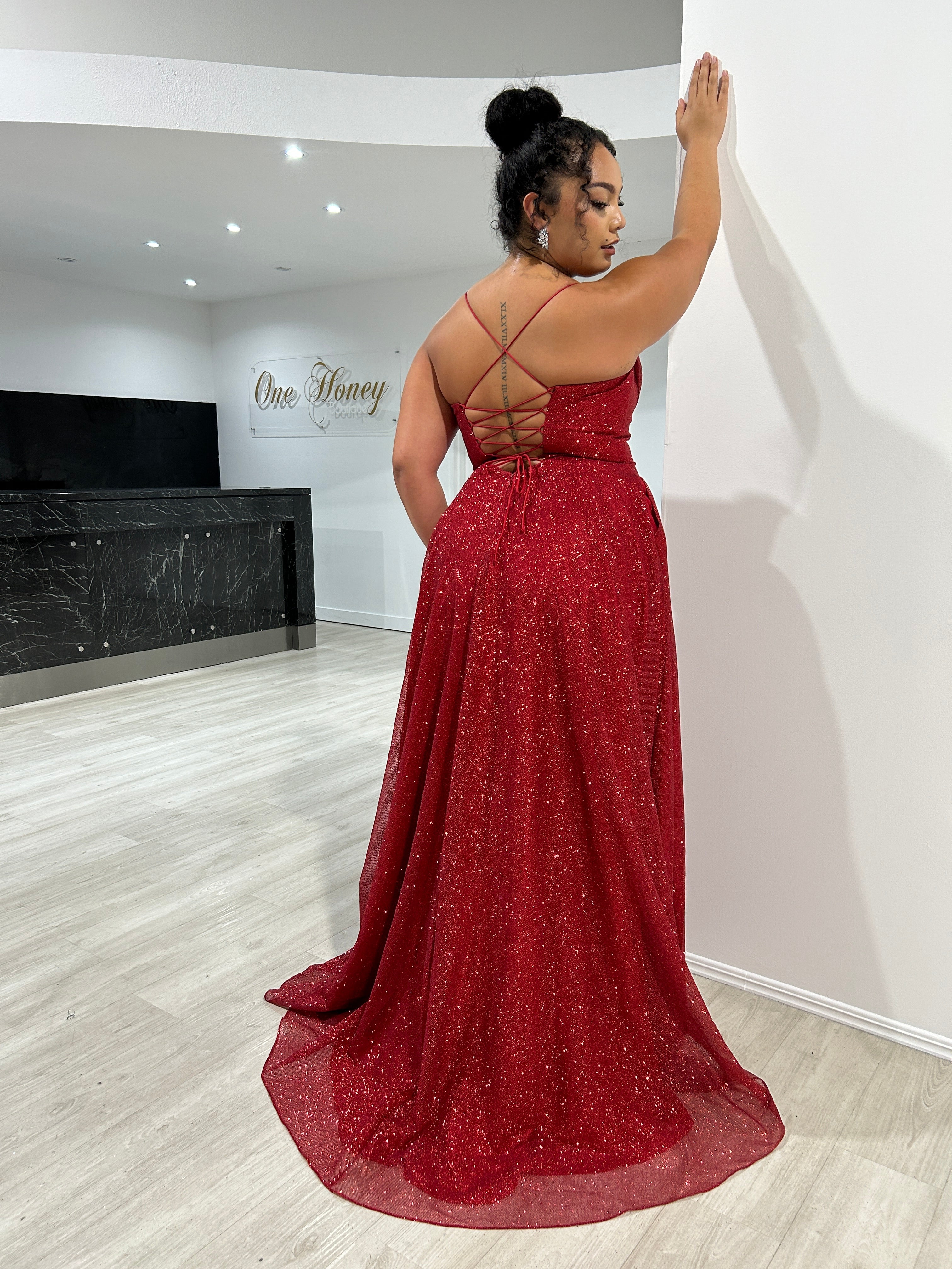 DREYA Curve red glitter corset school formal dress with cross-back design, showcased indoors. Brisbane to Gold Coast, Australia.