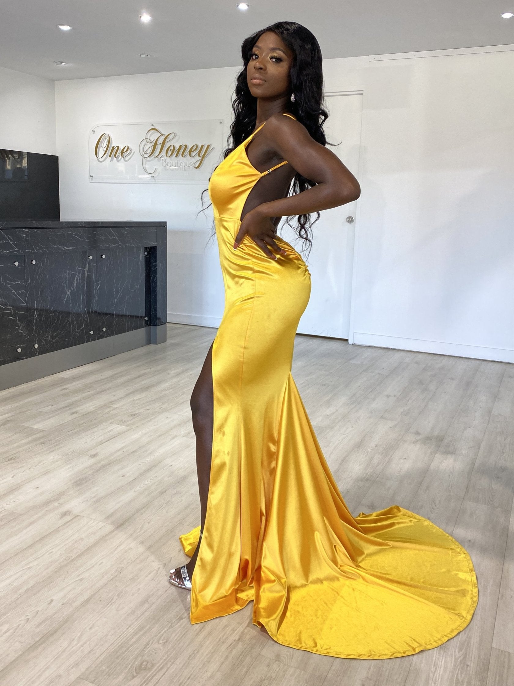Honey Couture MILEE mermaid evening gown in gold, featuring a low back, leg split, and adjustable straps. Australian designer prom dress.