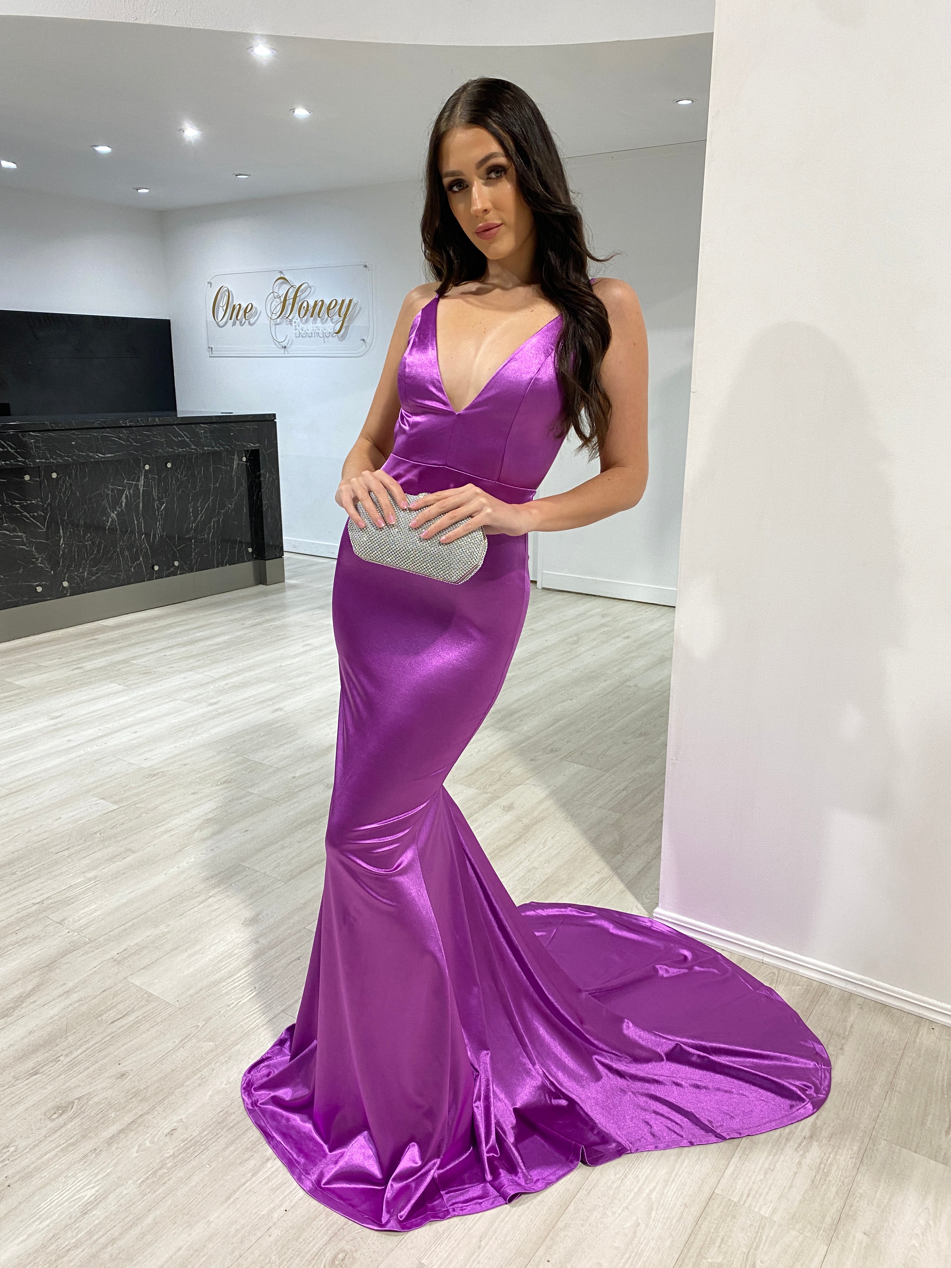 Woman wearing the Honey Couture MILEE low back mermaid evening gown, an Australian designer prom dress, in a luxurious silk stretch fabric.