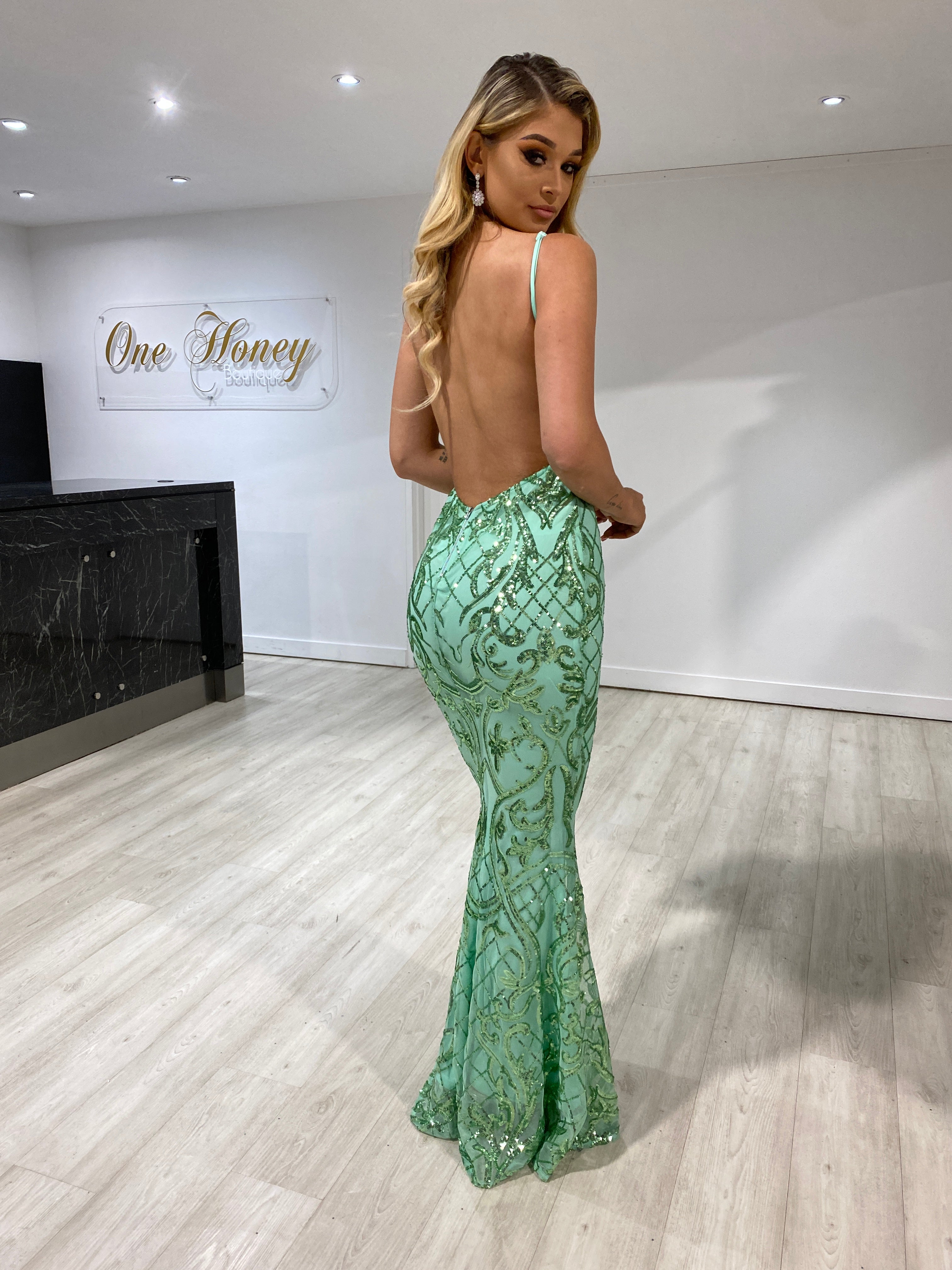 Woman wearing Honey Couture TRISTIN green sequin formal dress with low back, designed by Australian Designer; perfect for prom or evening.