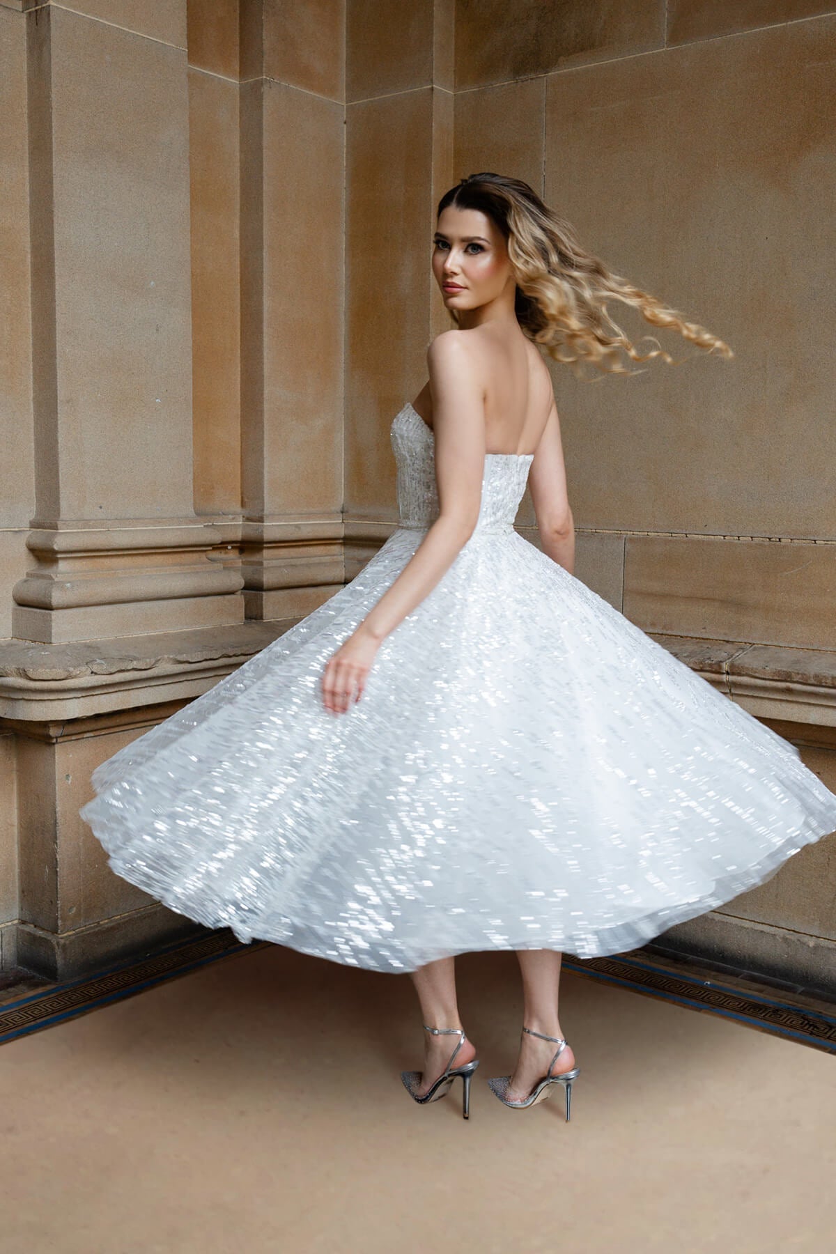 White strapless sequin and feather midi dress perfect for hens party or as a short bridal dress by Australian designer.