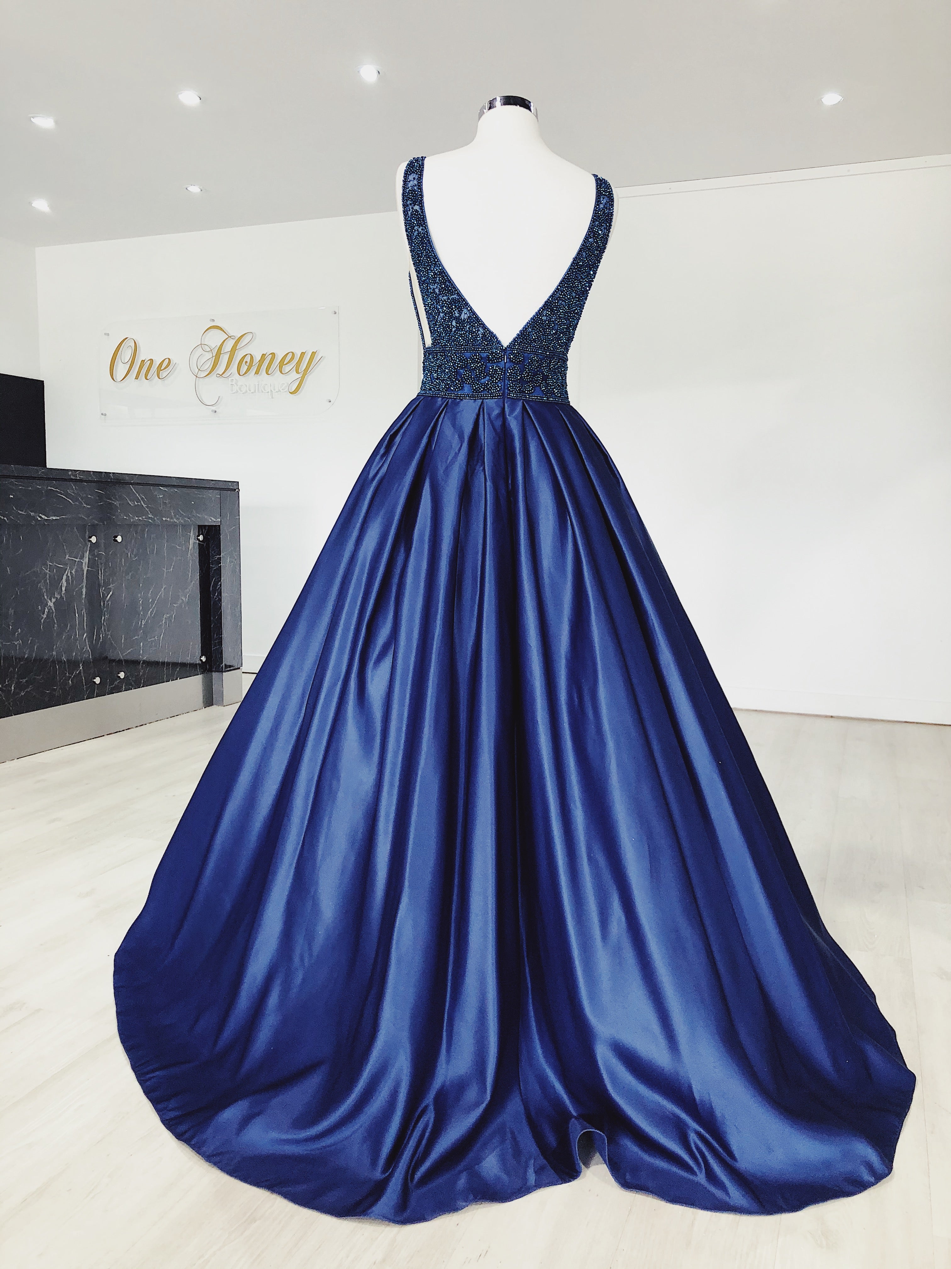 Rear view of Honey Couture EMELY Royal Blue Beaded Ball Gown, showcasing full skirt and deep plunge V-neck. Australian designer prom dress.
