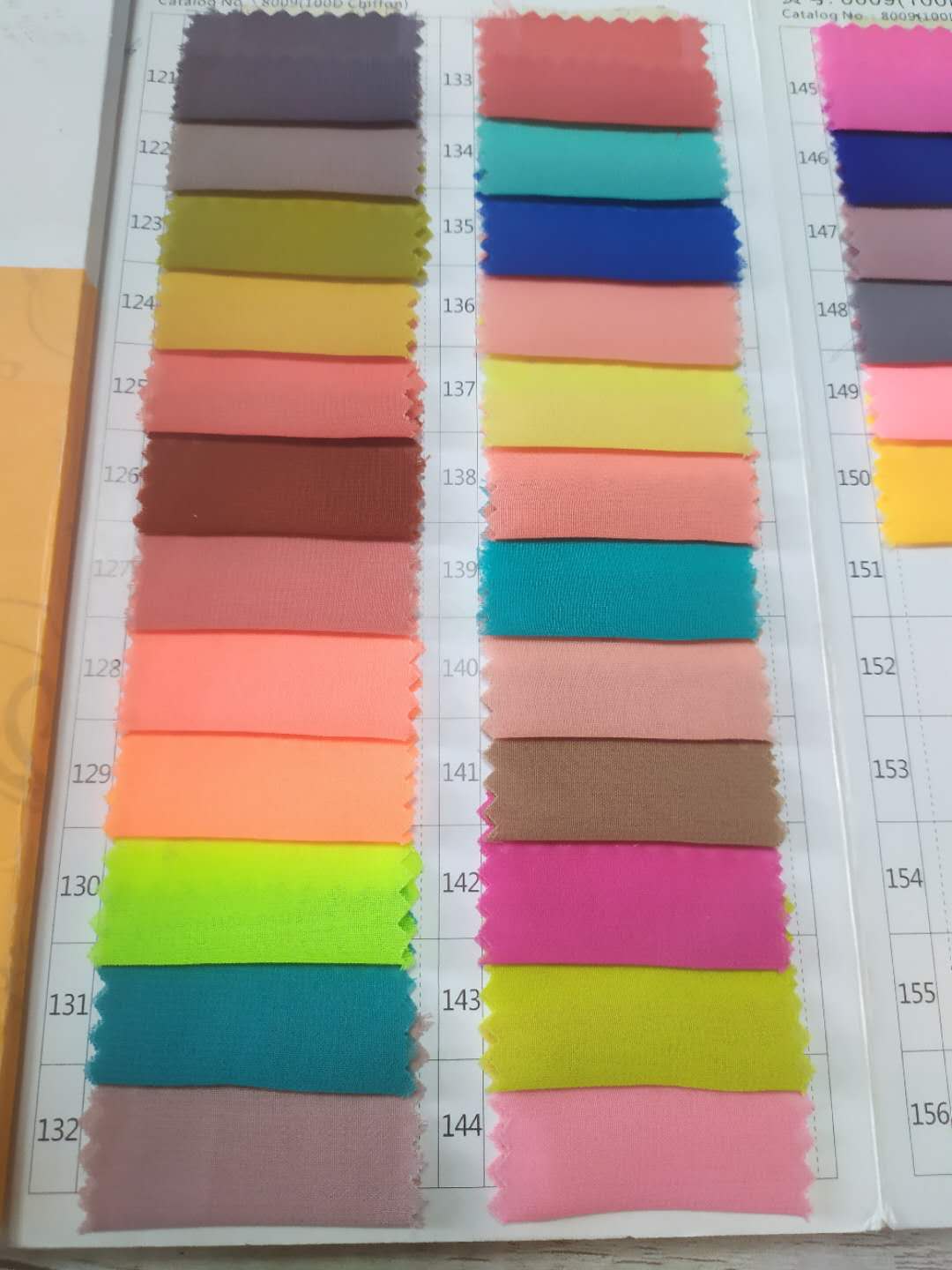 Color chart showing various fabric swatches in different shades for Honey Couture formal dresses.
