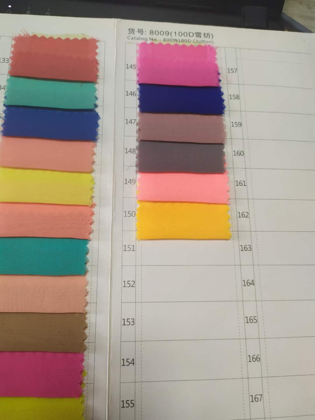 Fabric color chart showing various chiffon color options with swatches on a catalog page.