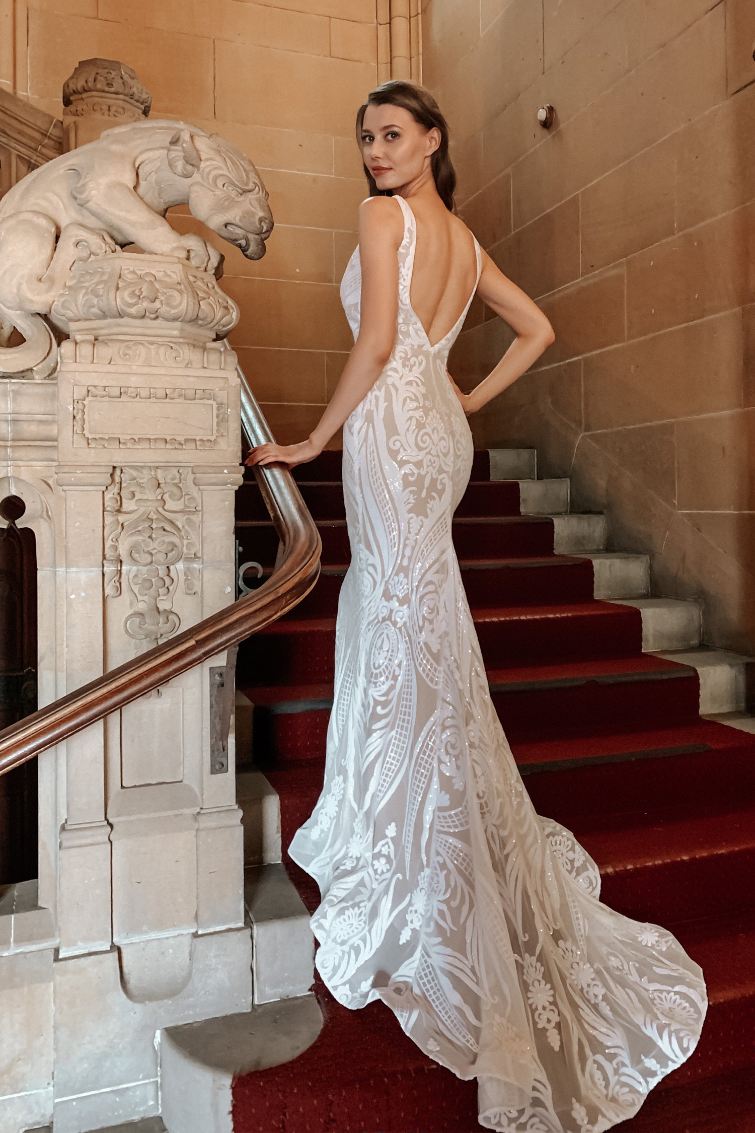TINA HOLLY COUTURE BA109 mermaid bridal dress with lace detailing, V back, white and nude tones, staircase setting, Brisbane to Gold Coast.