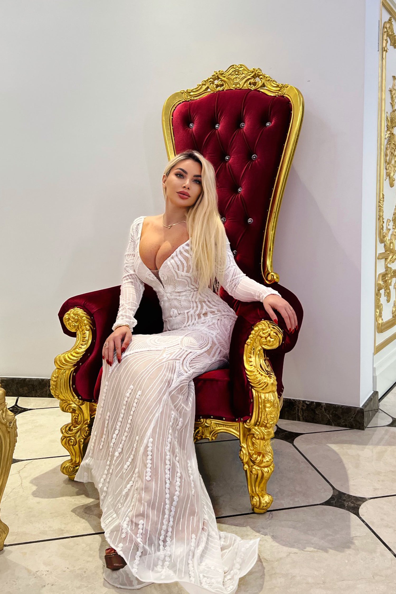 TINA HOLLY COUTURE BB025 V-neckline white and nude fitted mermaid wedding dress with ornate chair in elegant setting, Brisbane to Gold Coast